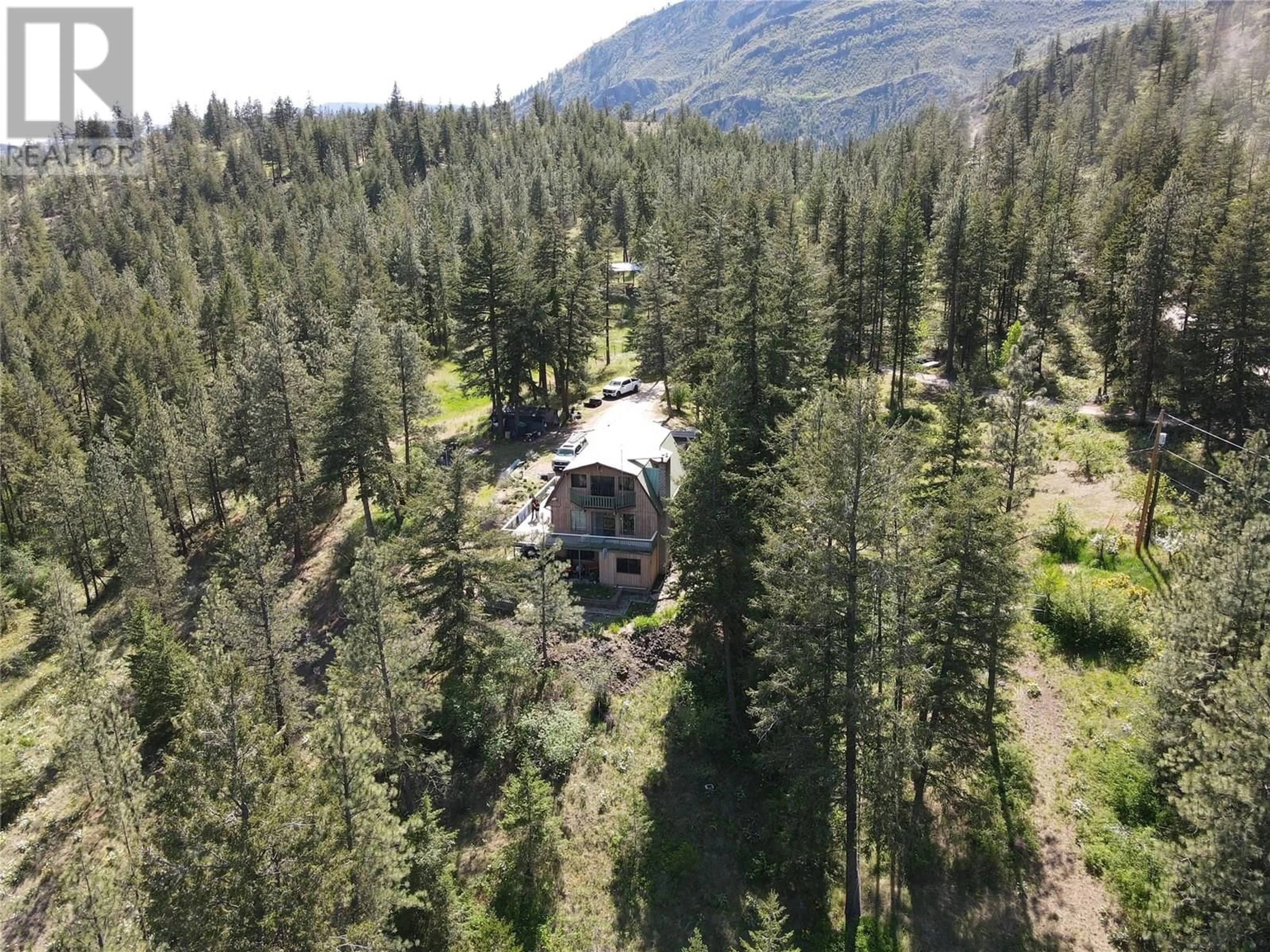 A pic from outside/outdoor area/front of a property/back of a property/a pic from drone, forest/trees view for 127 PARTINGTON ROAD, Kaleden British Columbia V0H1K0