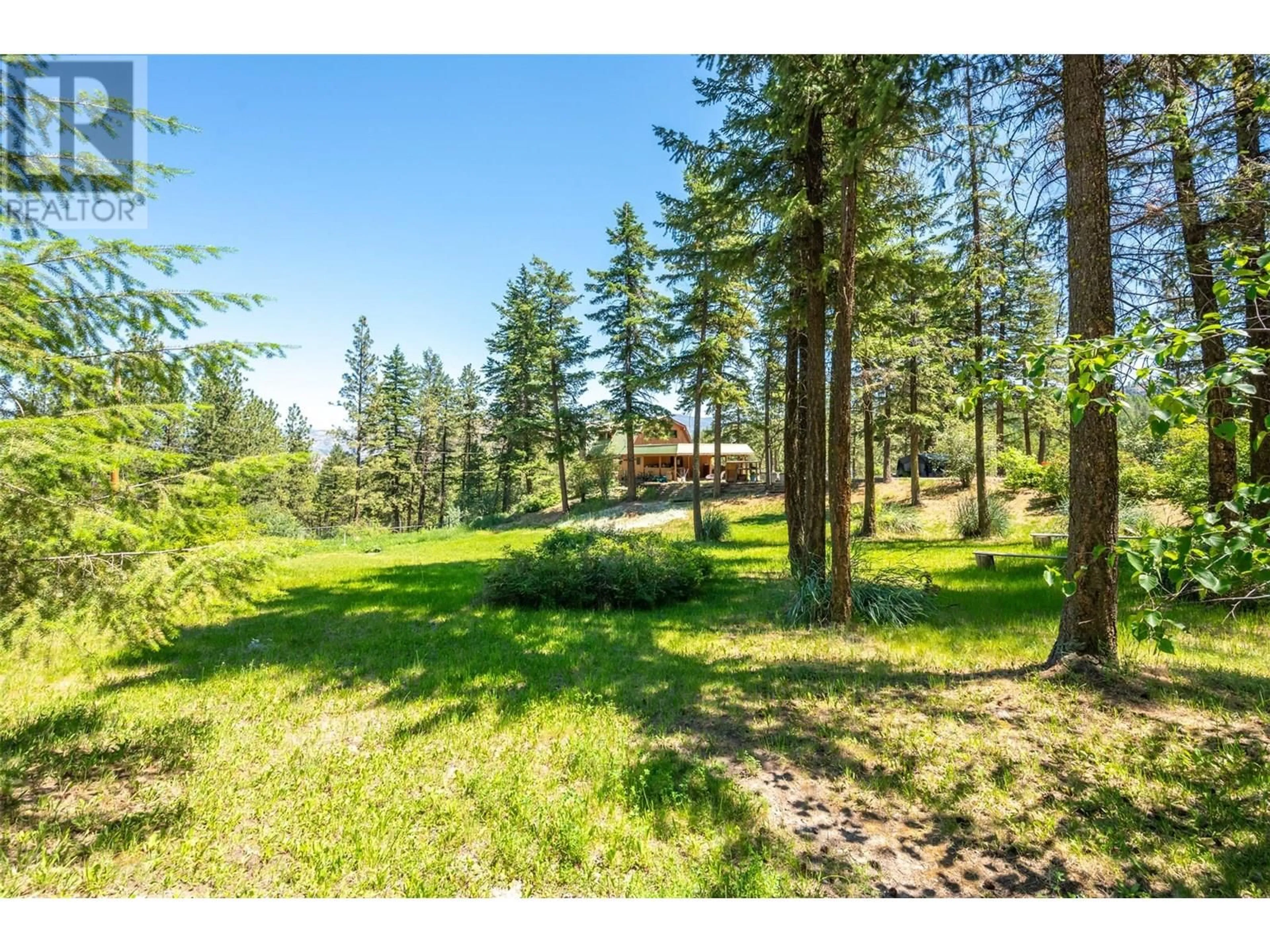 A pic from outside/outdoor area/front of a property/back of a property/a pic from drone, forest/trees view for 127 PARTINGTON ROAD, Kaleden British Columbia V0H1K0