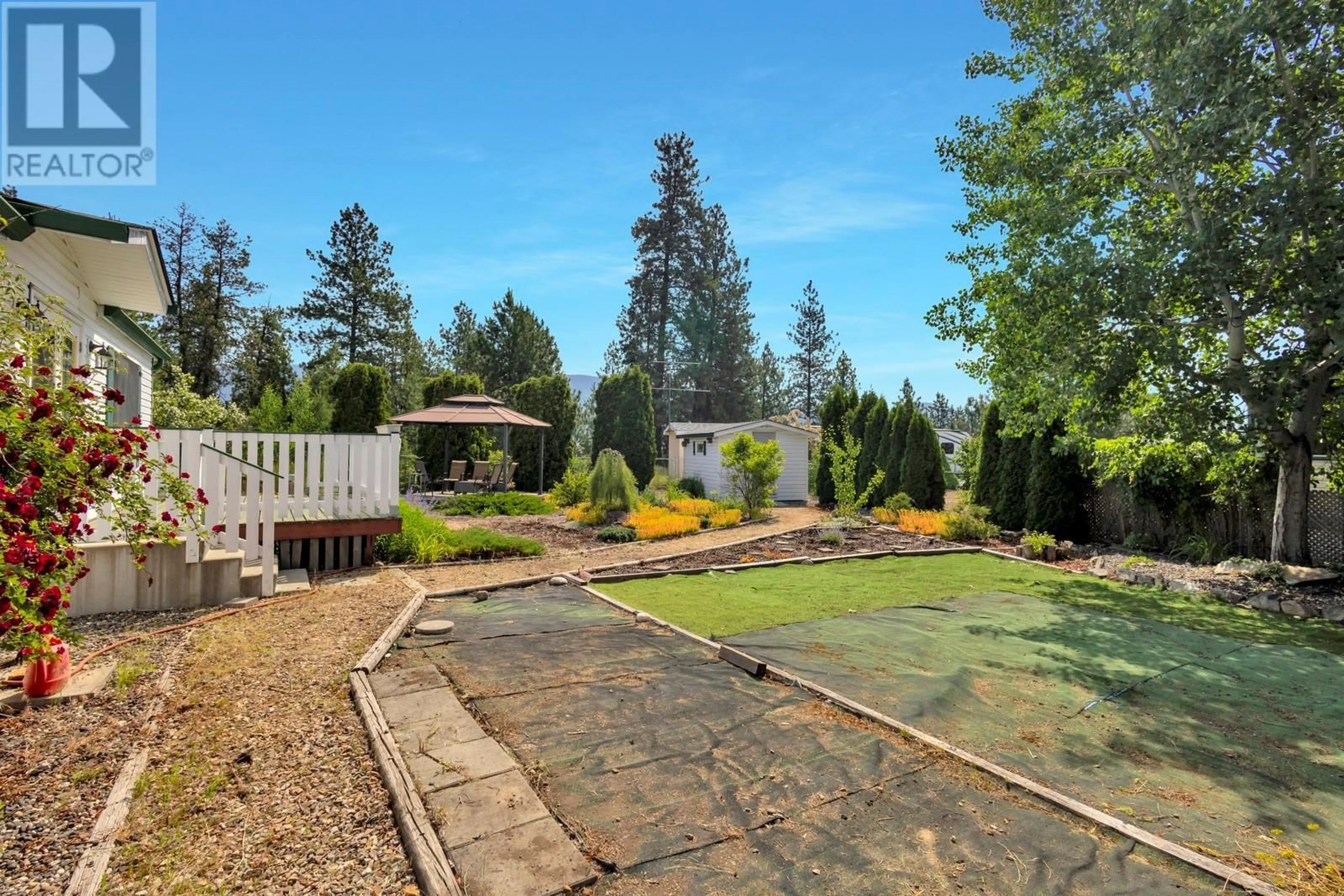 A pic from outside/outdoor area/front of a property/back of a property/a pic from drone, forest/trees view for 53 - 9510 HWY 97 N HIGHWAY, Vernon British Columbia V1H1R8
