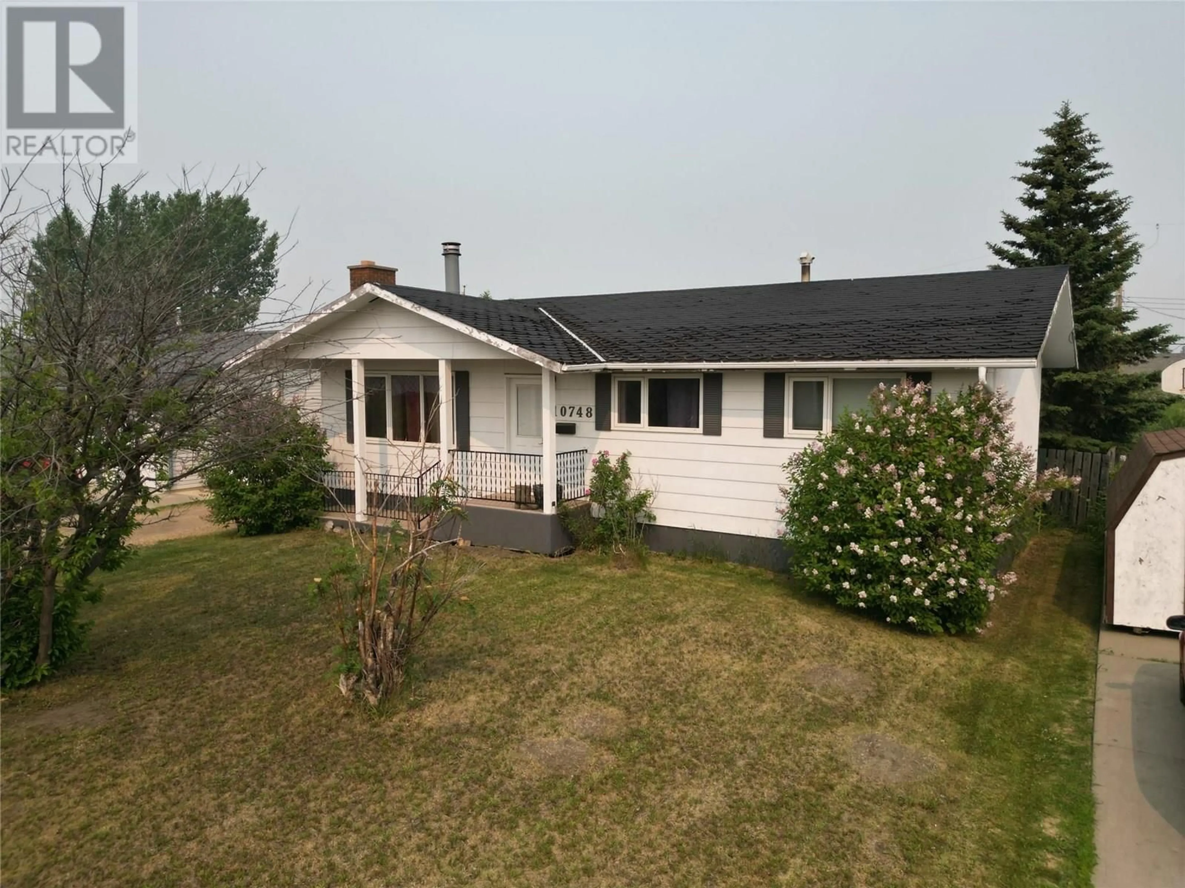 A pic from outside/outdoor area/front of a property/back of a property/a pic from drone, street for 10748 18 STREET, Dawson Creek British Columbia V1G4E2