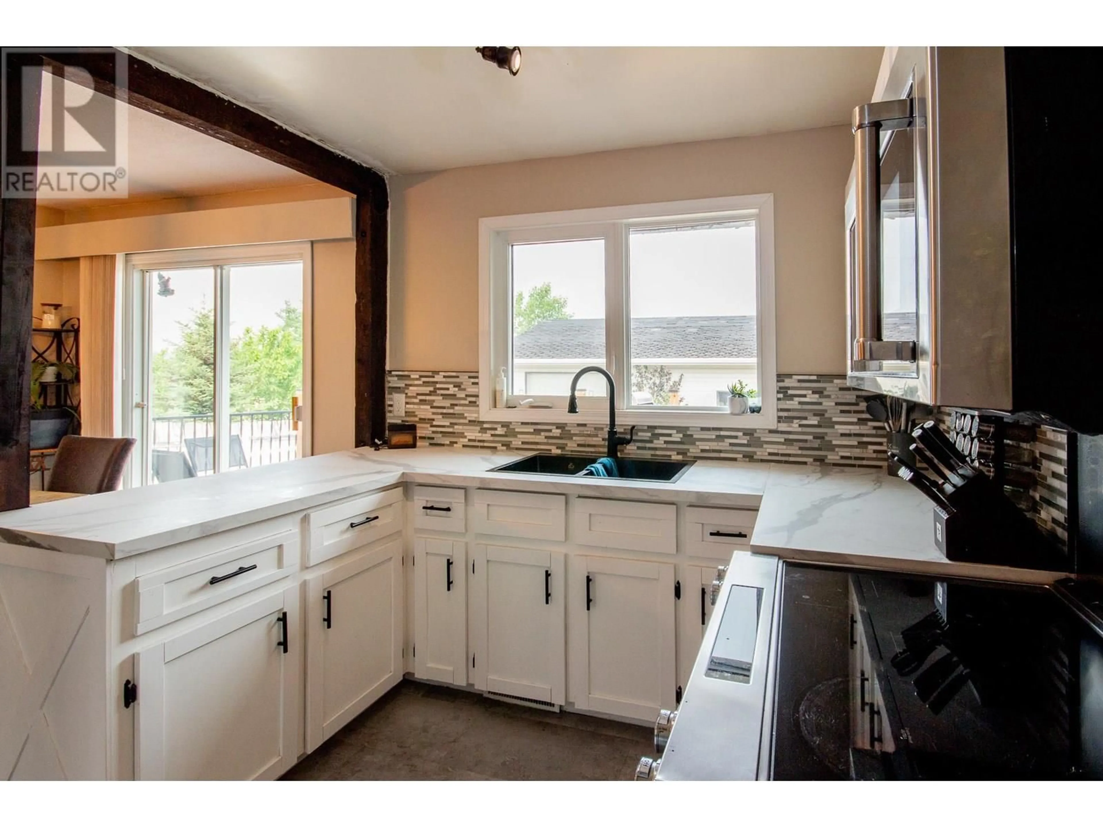 Open concept kitchen, ceramic/tile floor for 10748 18 STREET, Dawson Creek British Columbia V1G4E2
