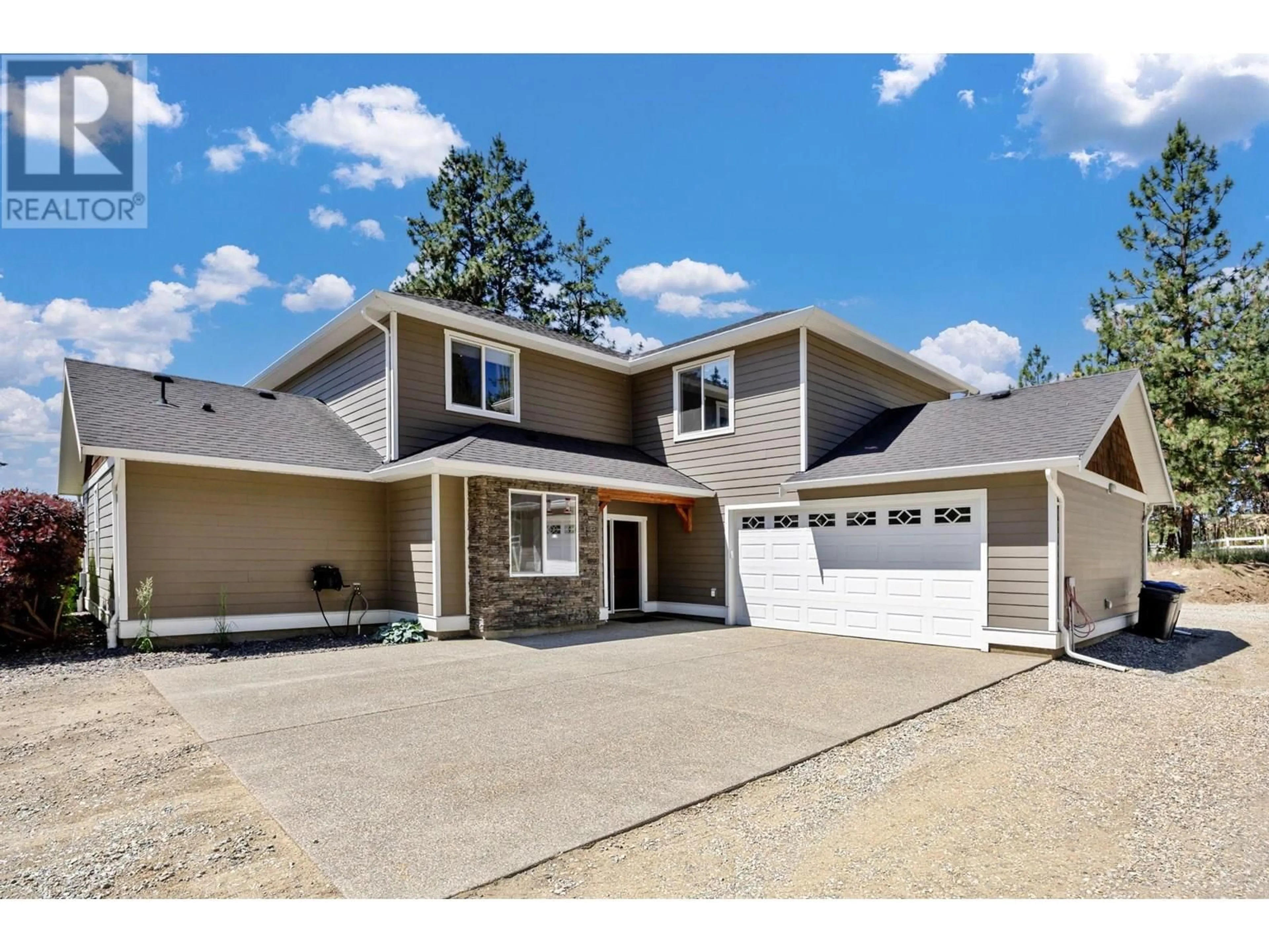 Home with vinyl exterior material, street for 6281 POSTILL LAKE ROAD, Kelowna British Columbia V1X7V3
