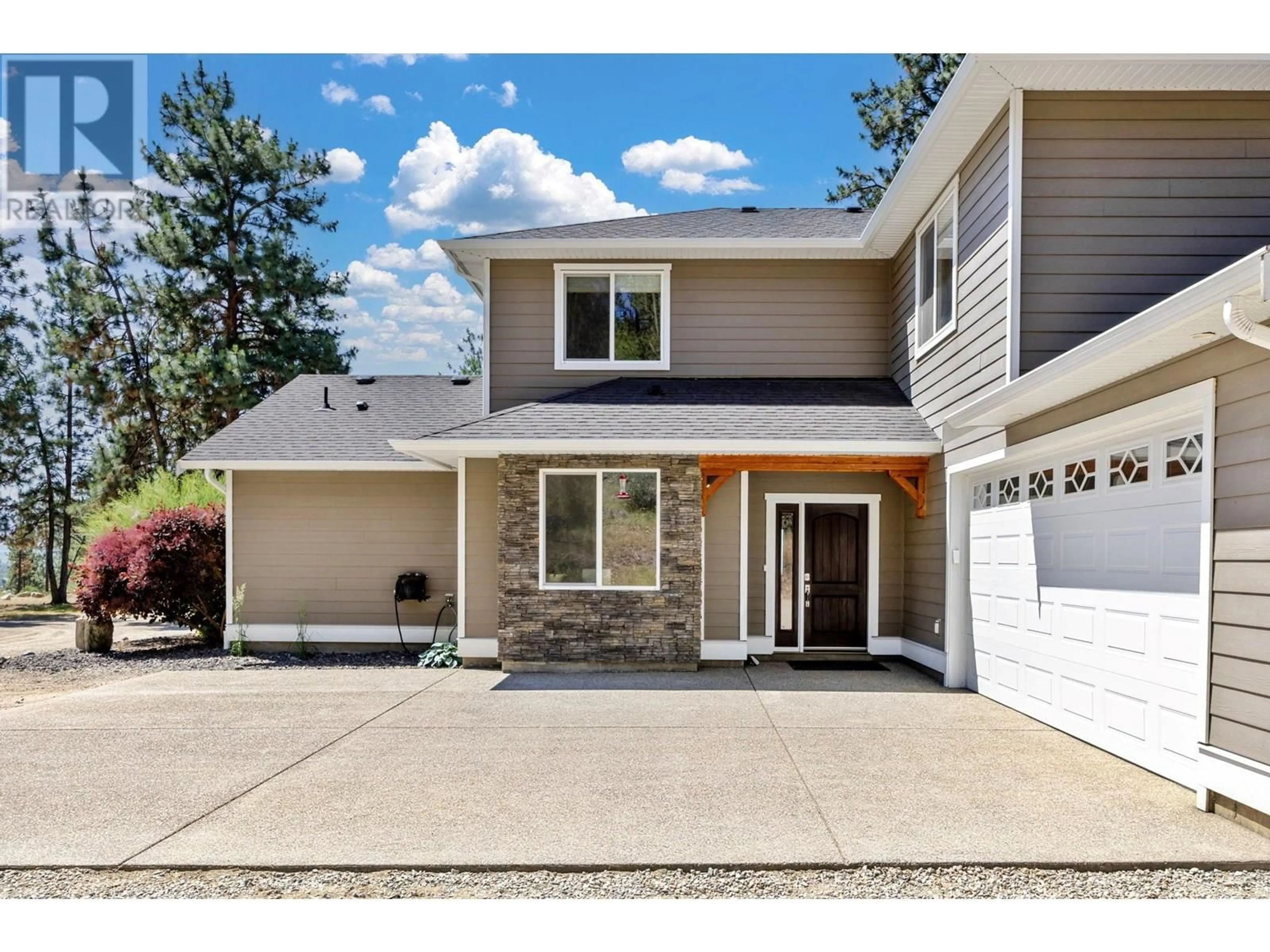 Home with vinyl exterior material, street for 6281 POSTILL LAKE ROAD, Kelowna British Columbia V1X7V3