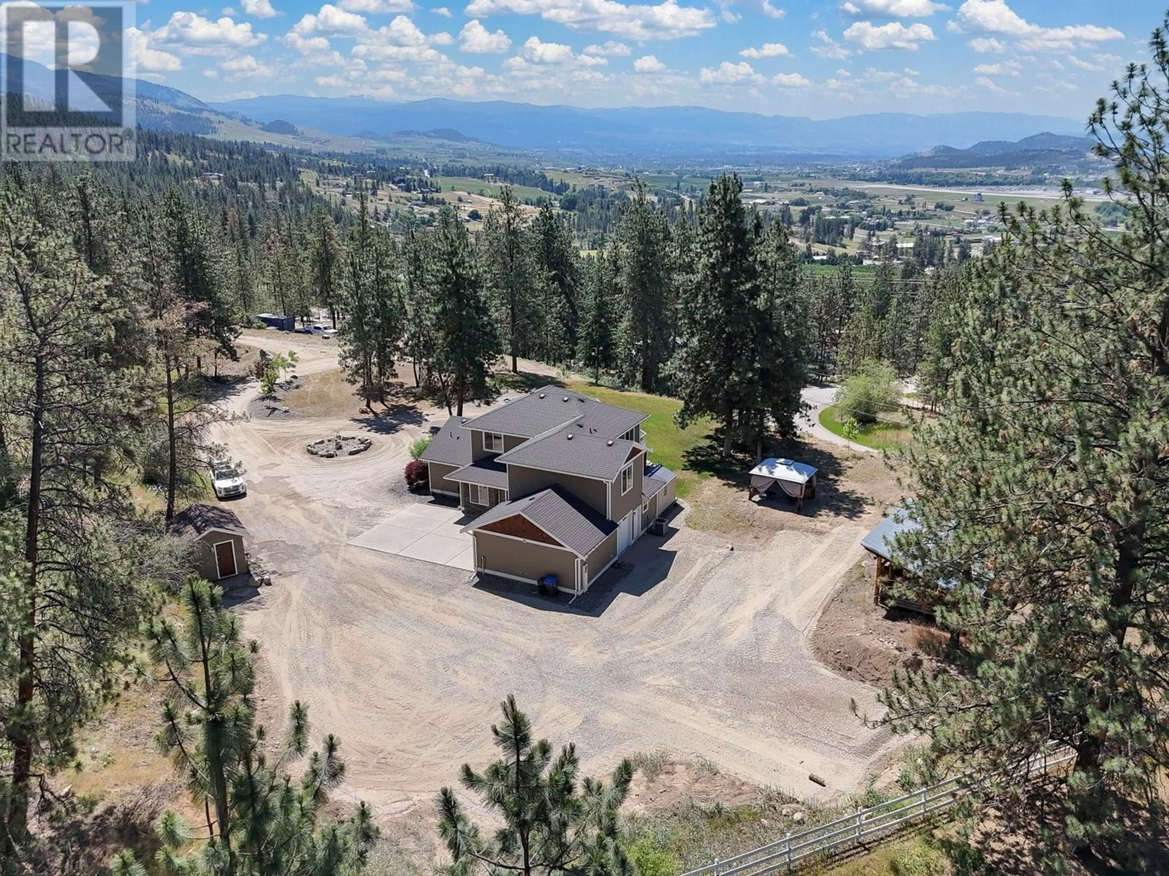 A pic from outside/outdoor area/front of a property/back of a property/a pic from drone, mountain view for 6281 POSTILL LAKE ROAD, Kelowna British Columbia V1X7V3