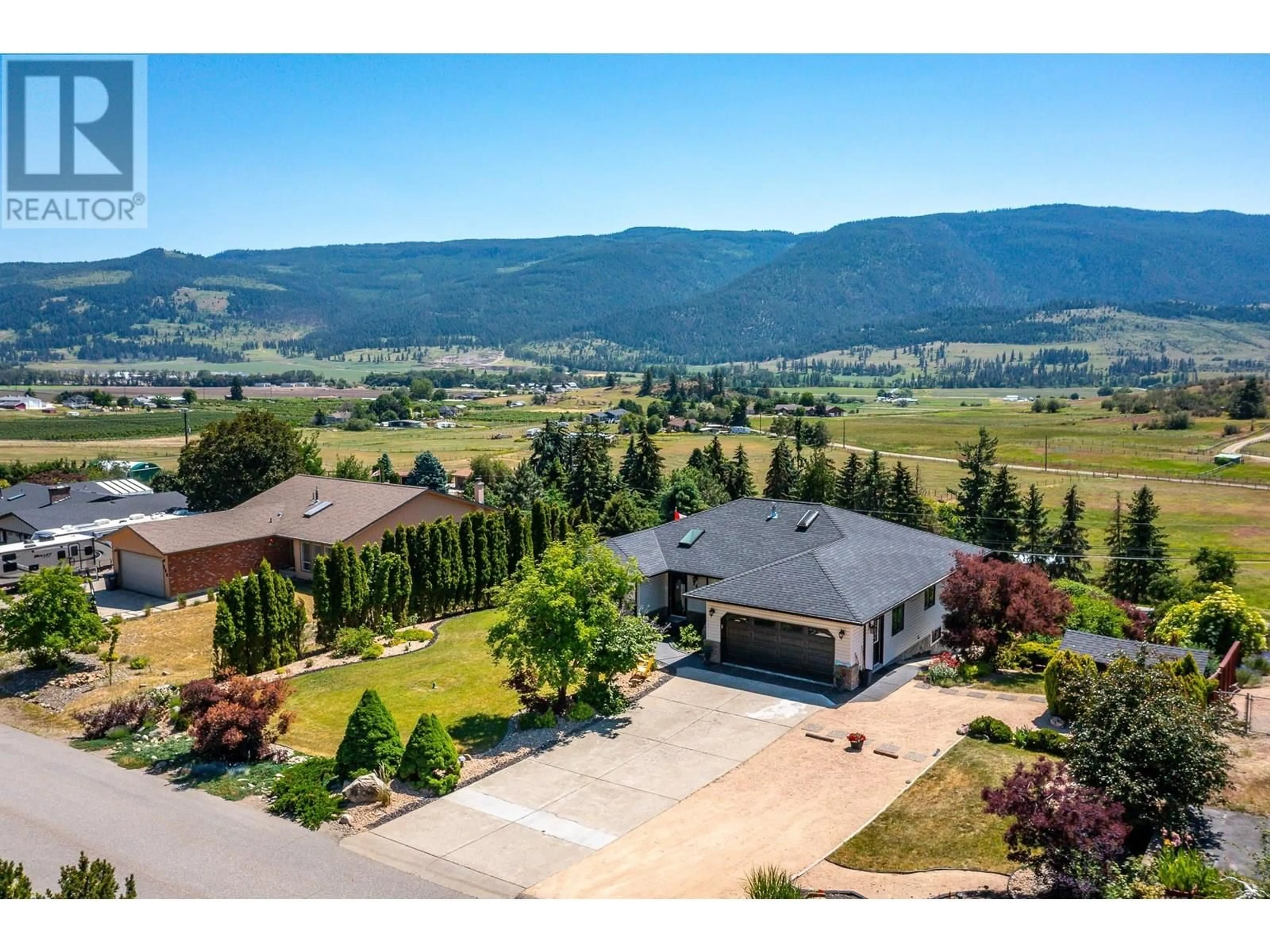 A pic from outside/outdoor area/front of a property/back of a property/a pic from drone, mountain view for 248 SCENIC DRIVE, Coldstream British Columbia V1B2X4