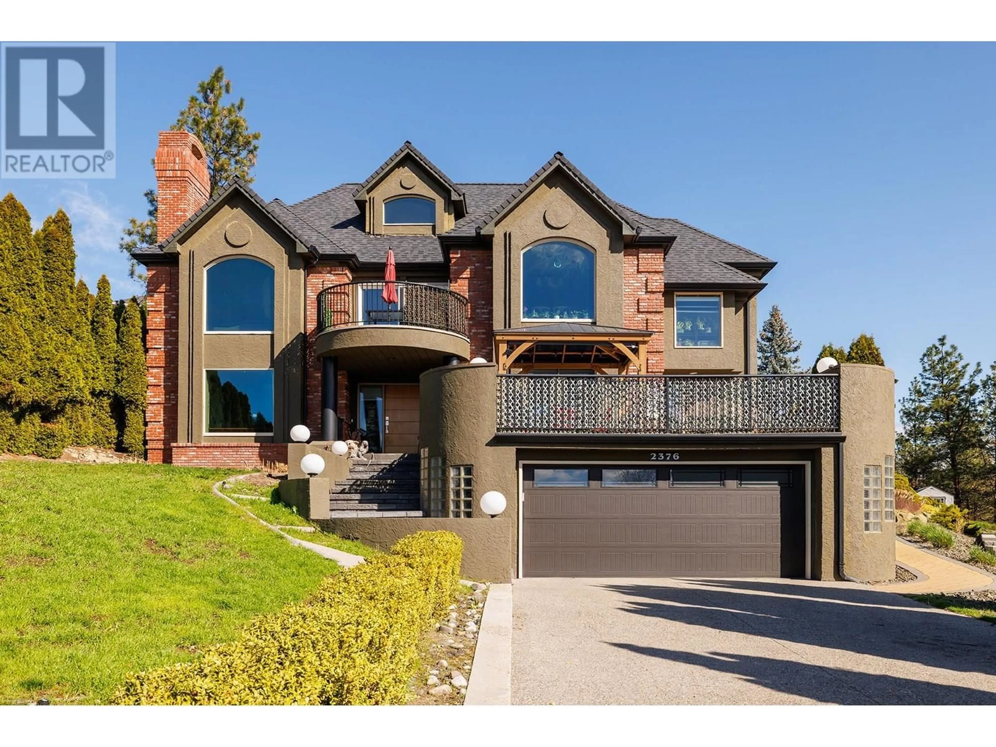 Home with brick exterior material, street for 2376 NAHANNI COURT, Kelowna British Columbia V1V1N1