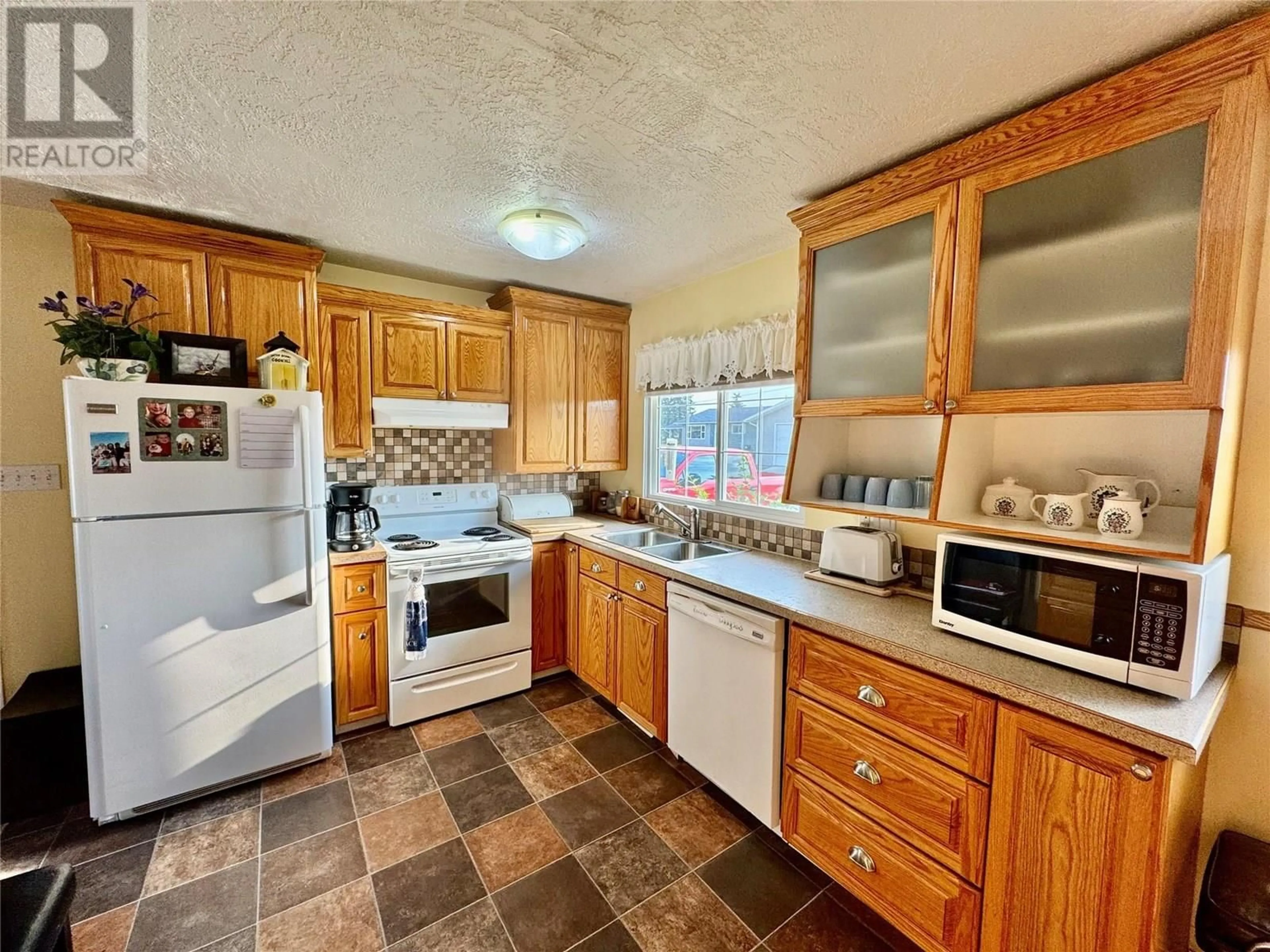 Standard kitchen, ceramic/tile floor for 10744 18 STREET, Dawson Creek British Columbia V1G4E2