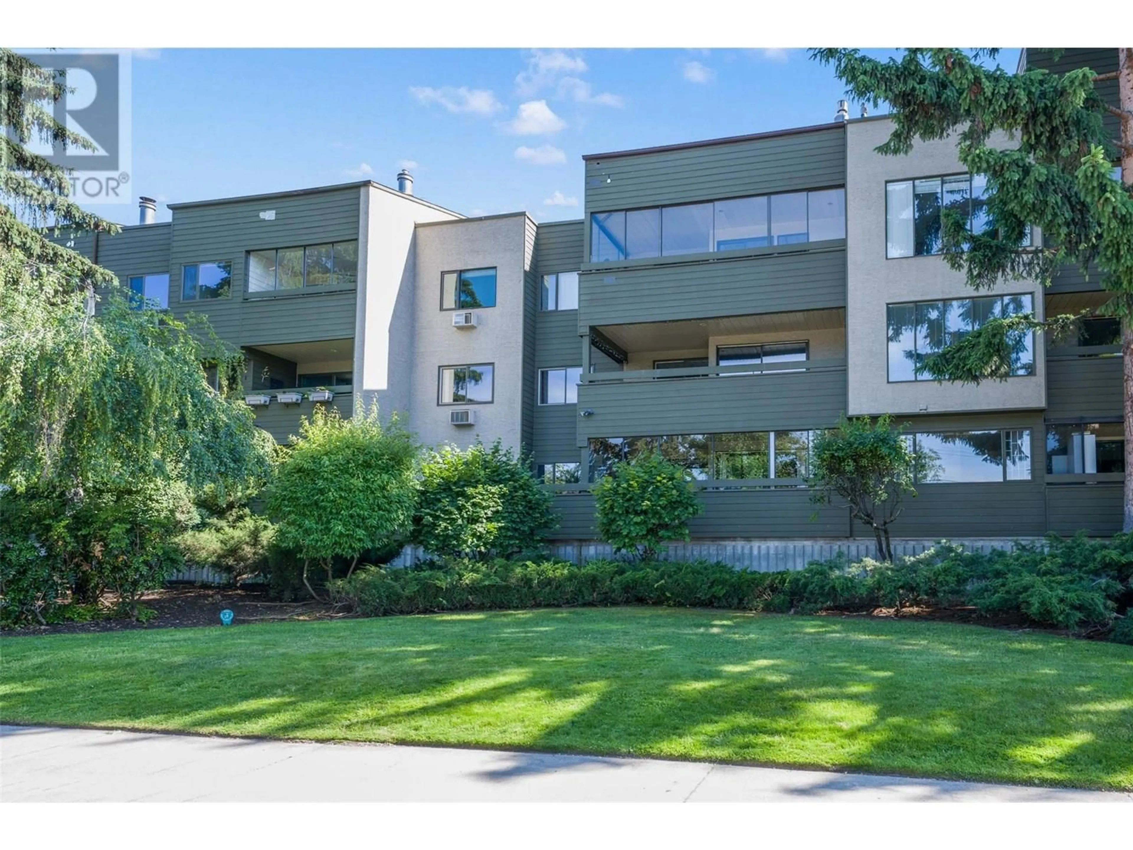 A pic from outside/outdoor area/front of a property/back of a property/a pic from drone, street for 218 - 1056 BERNARD AVENUE, Kelowna British Columbia V1Y8L7