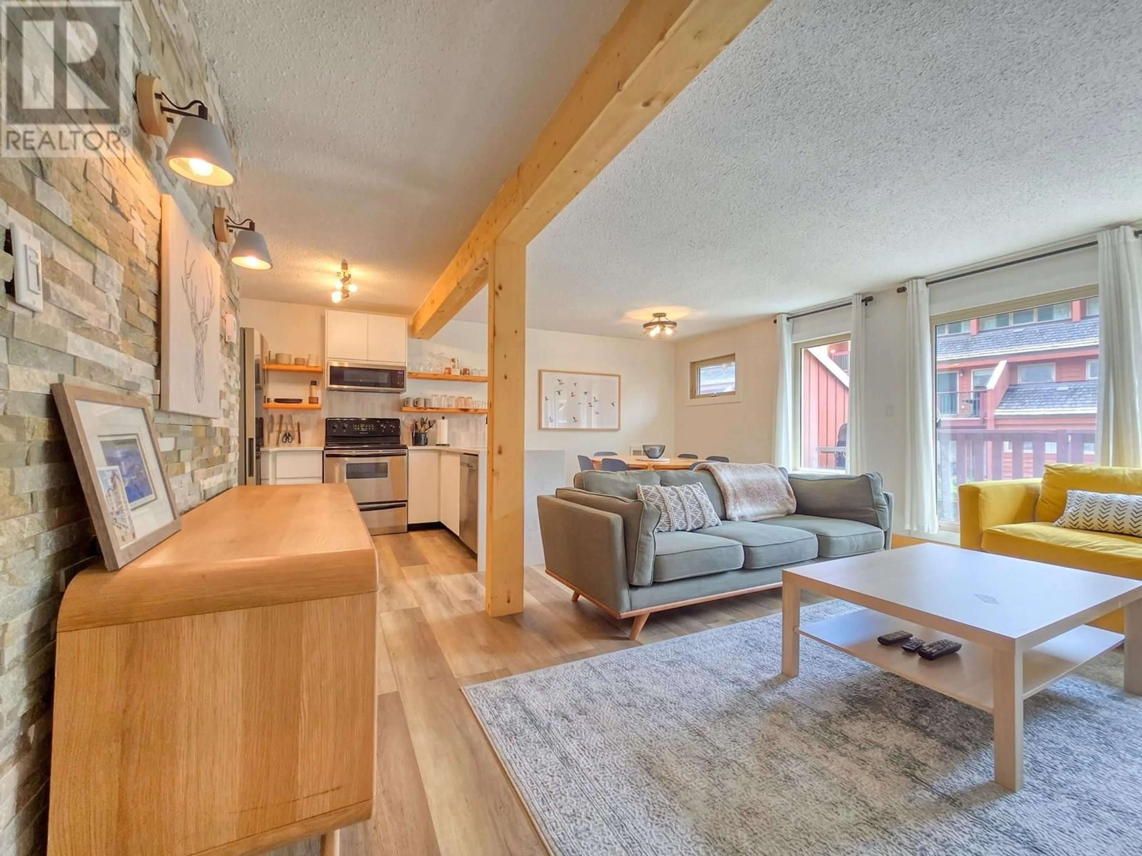 Living room with furniture, wood/laminate floor for 323 - 2030 PANORAMA DRIVE, Panorama British Columbia V0A1T0