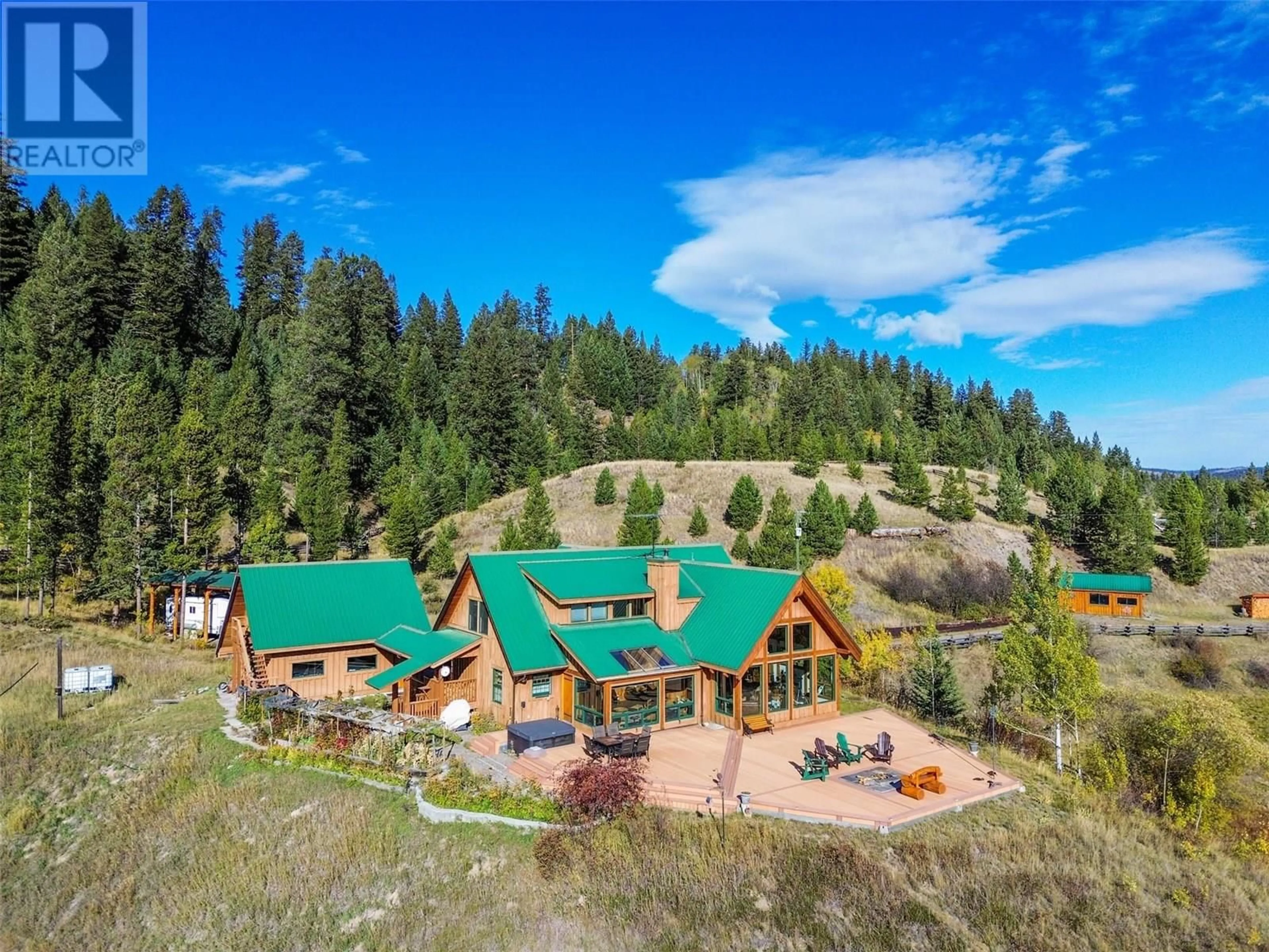 A pic from outside/outdoor area/front of a property/back of a property/a pic from drone, mountain view for 7020 BROLIN ROAD, Logan Lake British Columbia V0K1W0