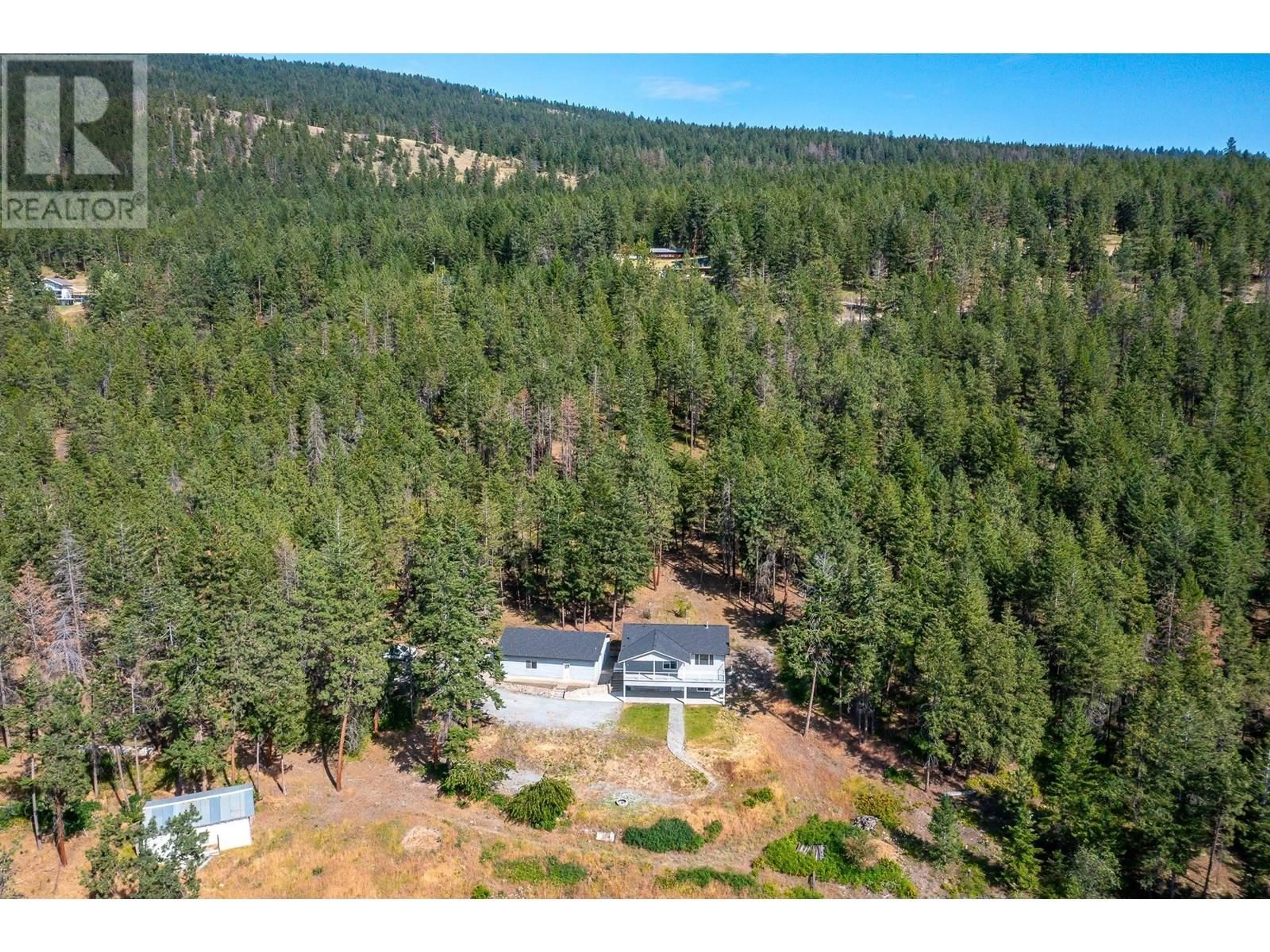 A pic from outside/outdoor area/front of a property/back of a property/a pic from drone, forest/trees view for 15990 BARKLEY ROAD, Lake Country British Columbia V4V1B4
