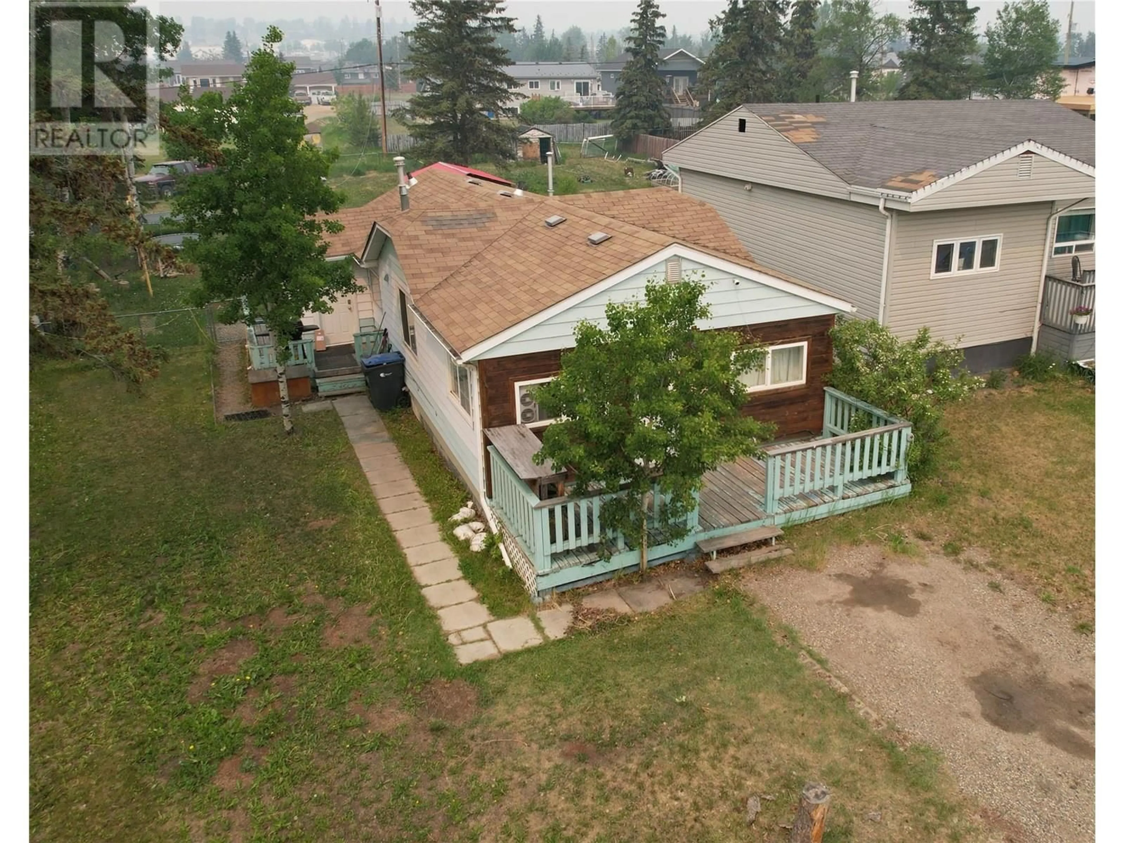 A pic from outside/outdoor area/front of a property/back of a property/a pic from drone, street for 1616 102 AVENUE, Dawson Creek British Columbia V1G2E4