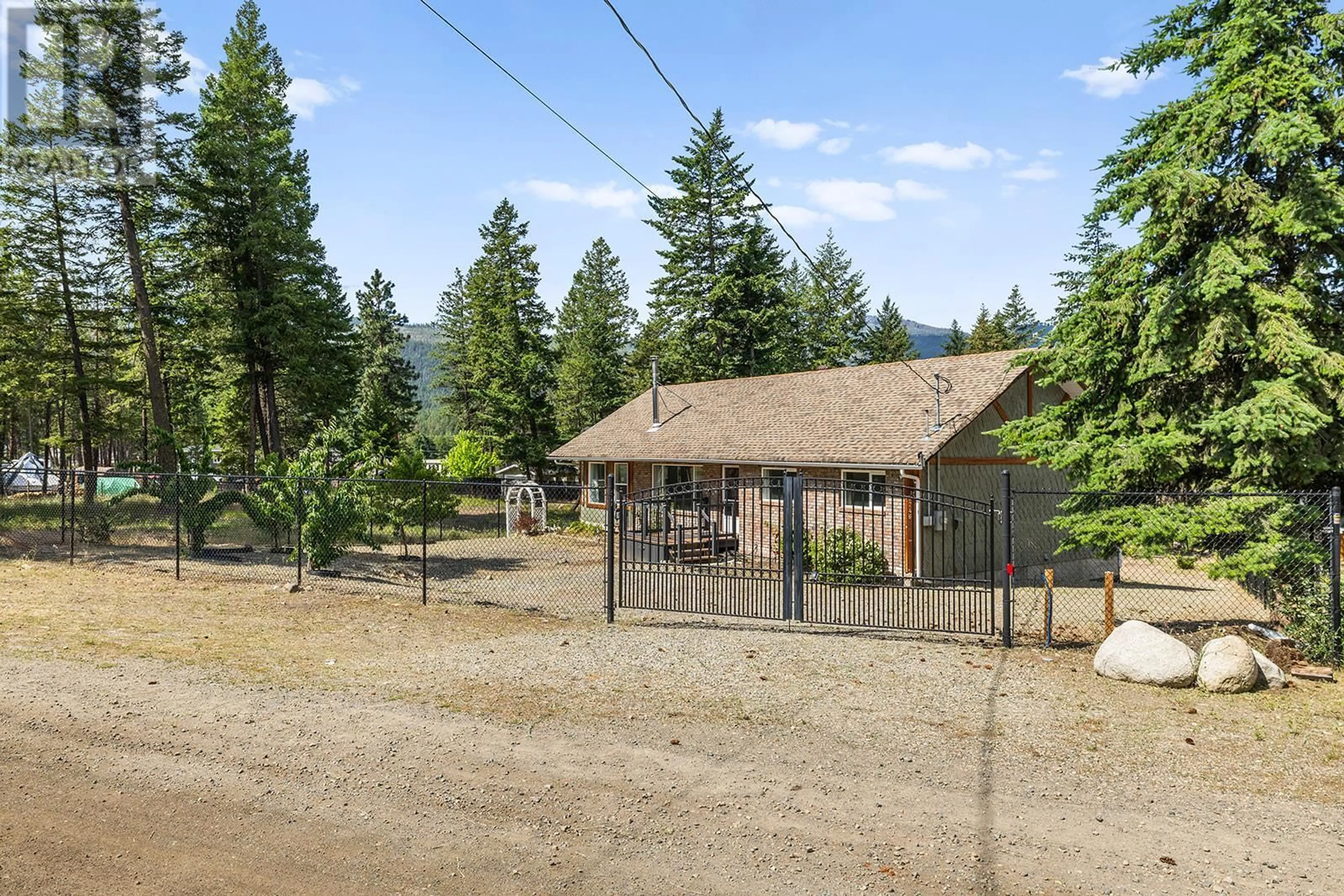 A pic from outside/outdoor area/front of a property/back of a property/a pic from drone, mountain view for 7246 DUNWATERS ROAD, Kelowna British Columbia V1Z3W4