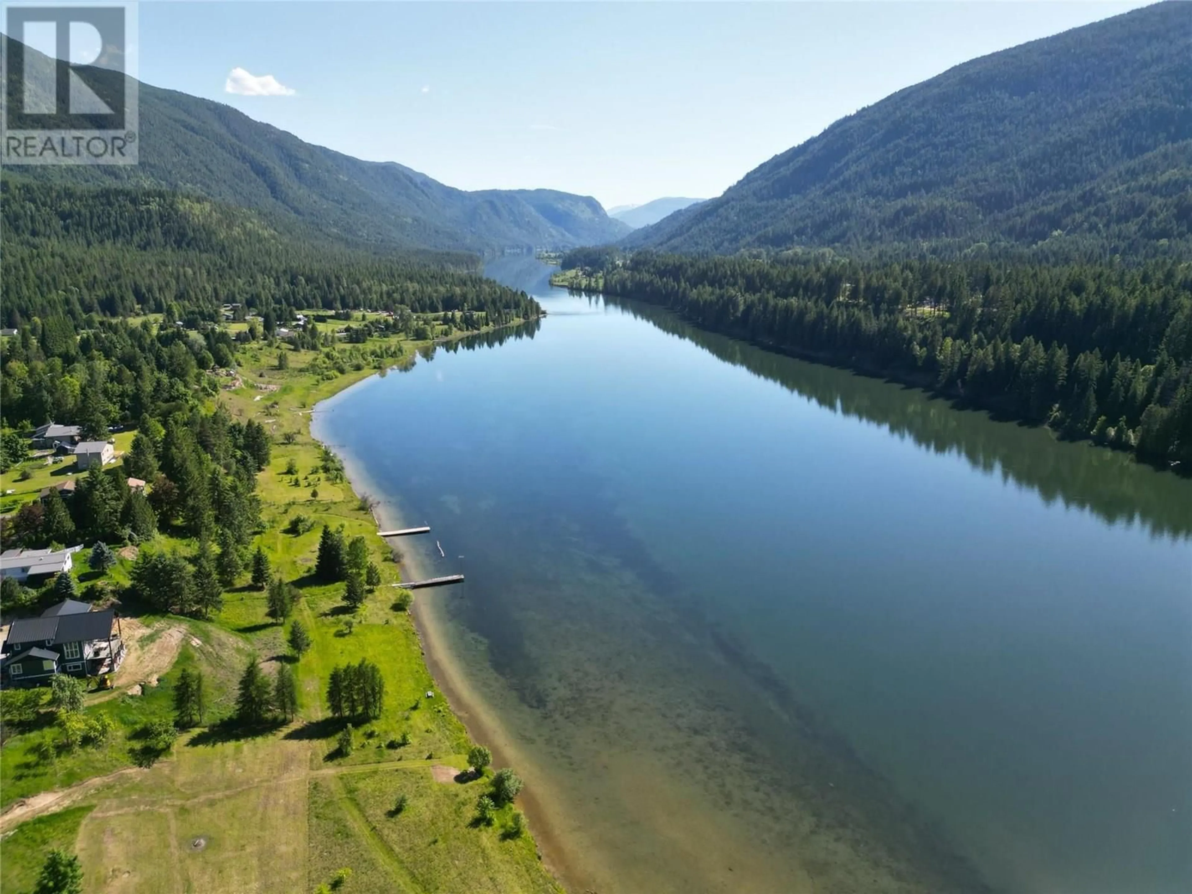 A pic from outside/outdoor area/front of a property/back of a property/a pic from drone, water/lake/river/ocean view for 1062 SCAMP ROAD, Glade British Columbia V1N4R3