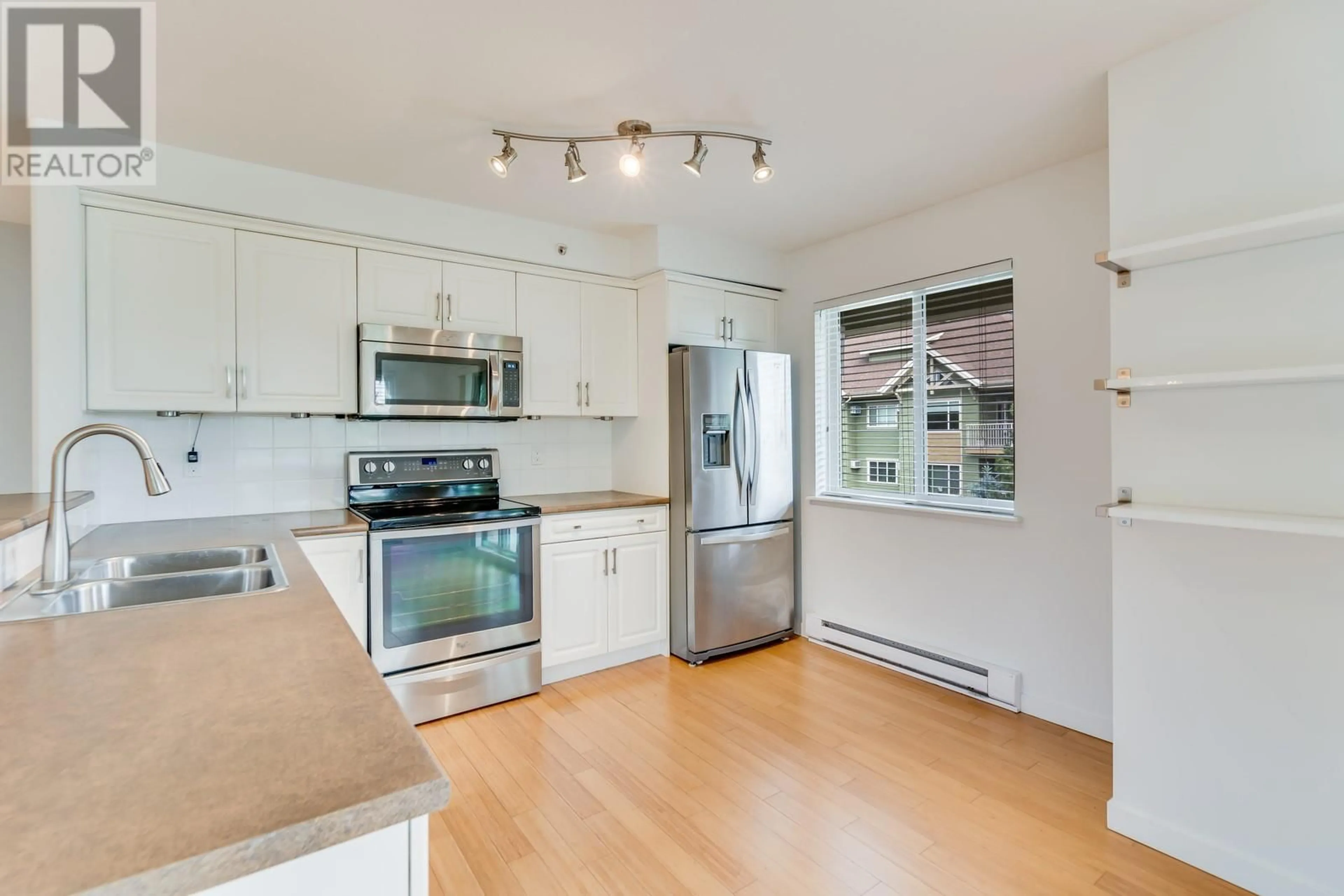 Open concept kitchen, unknown for 409 - 686 LEQUIME ROAD, Kelowna British Columbia V1W1A4