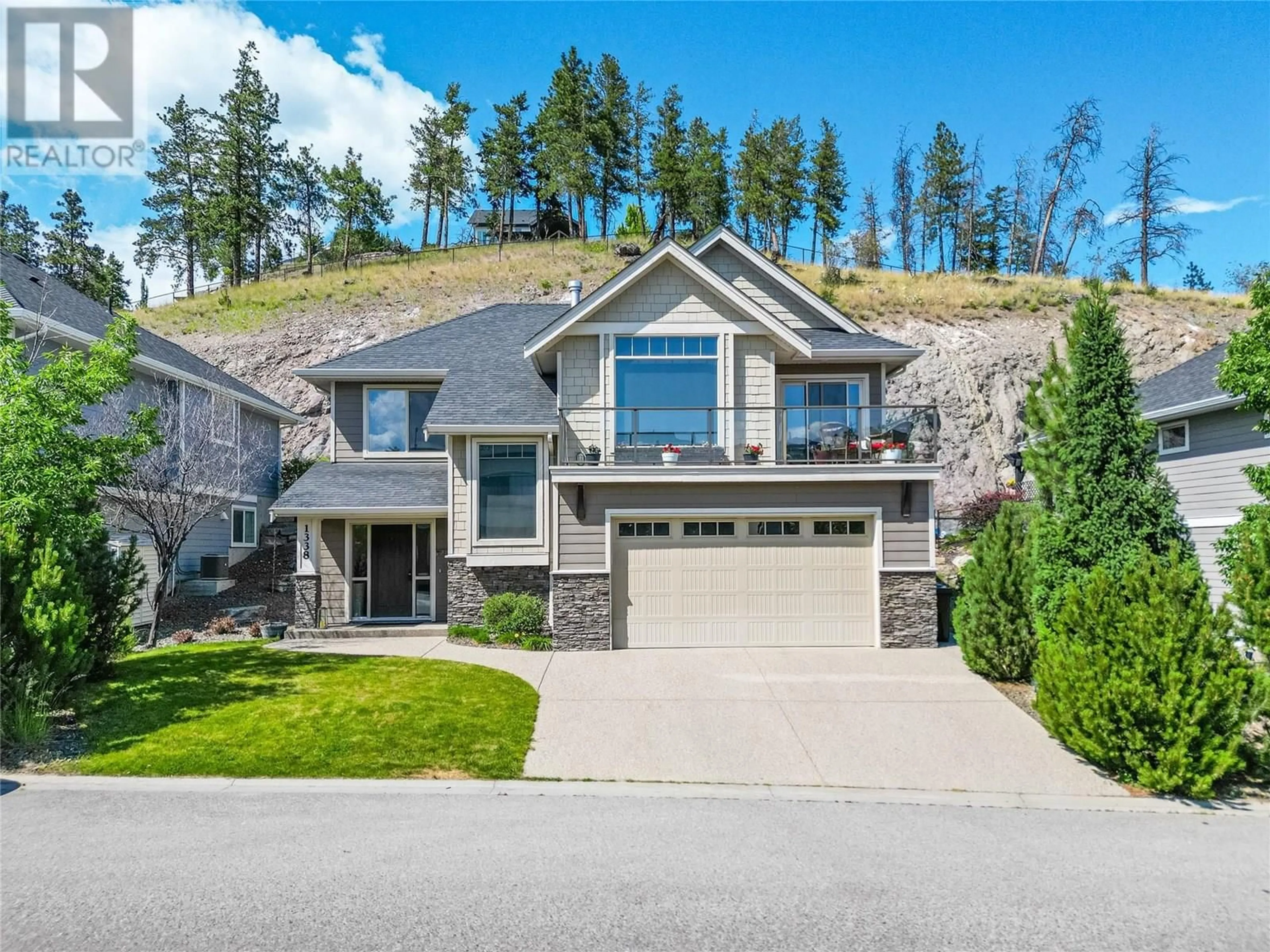 Home with brick exterior material, mountain view for 1338 ROCKY POINT DRIVE, Kelowna British Columbia V1V2Z9