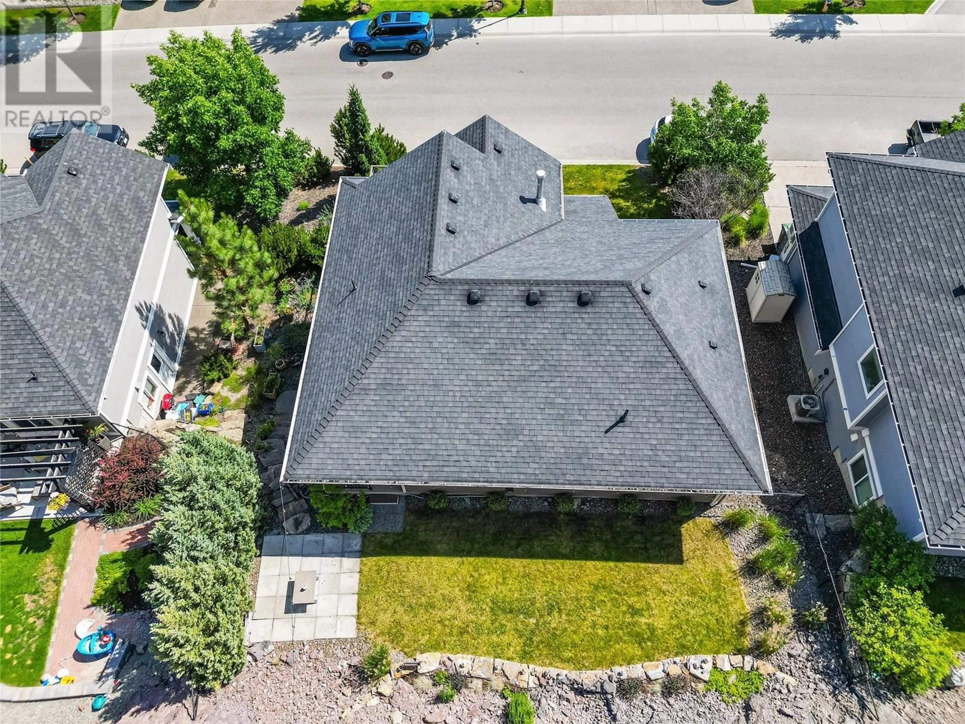 A pic from outside/outdoor area/front of a property/back of a property/a pic from drone, street for 1338 ROCKY POINT DRIVE, Kelowna British Columbia V1V2Z9
