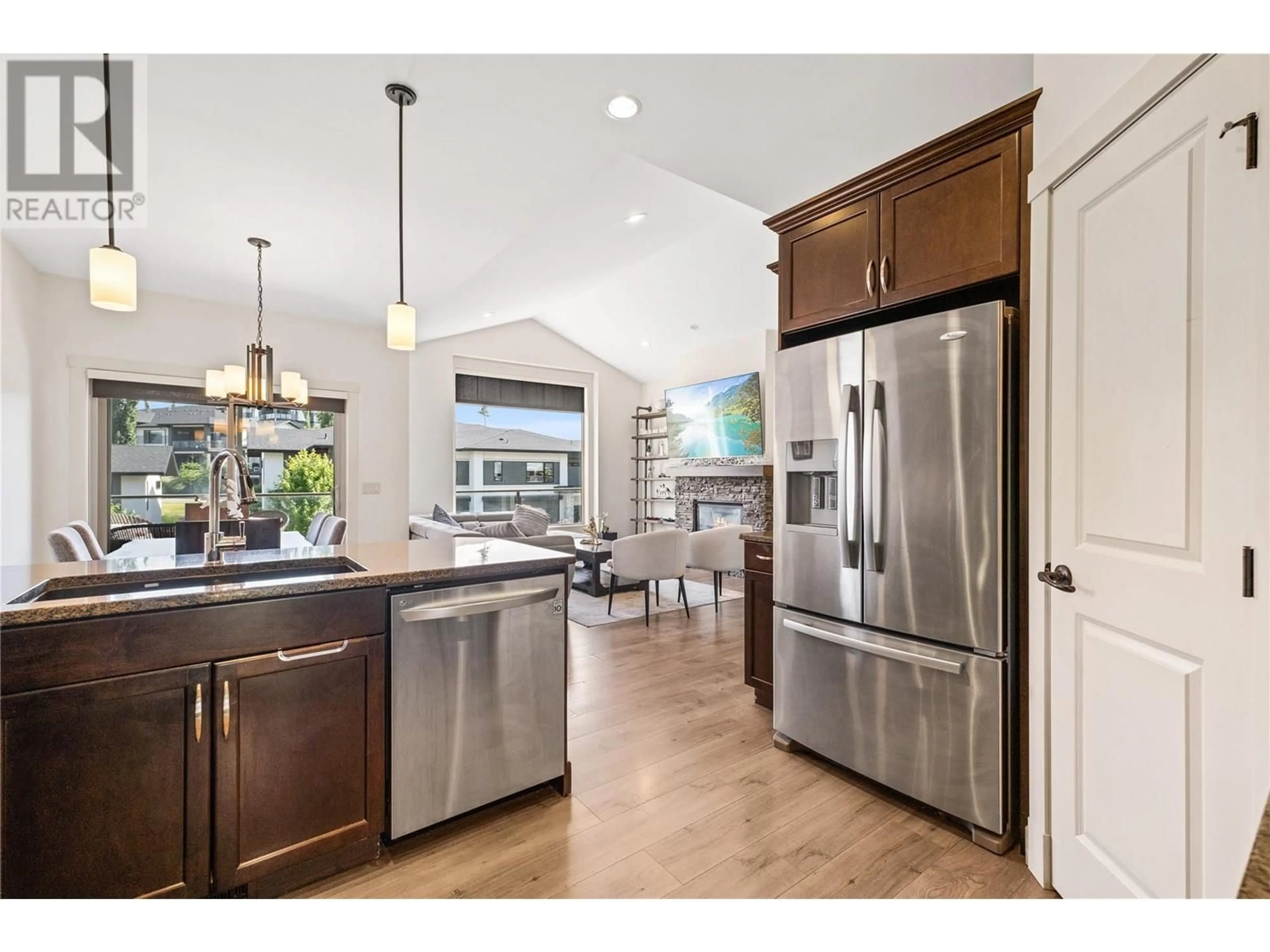 Open concept kitchen, wood/laminate floor for 1338 ROCKY POINT DRIVE, Kelowna British Columbia V1V2Z9