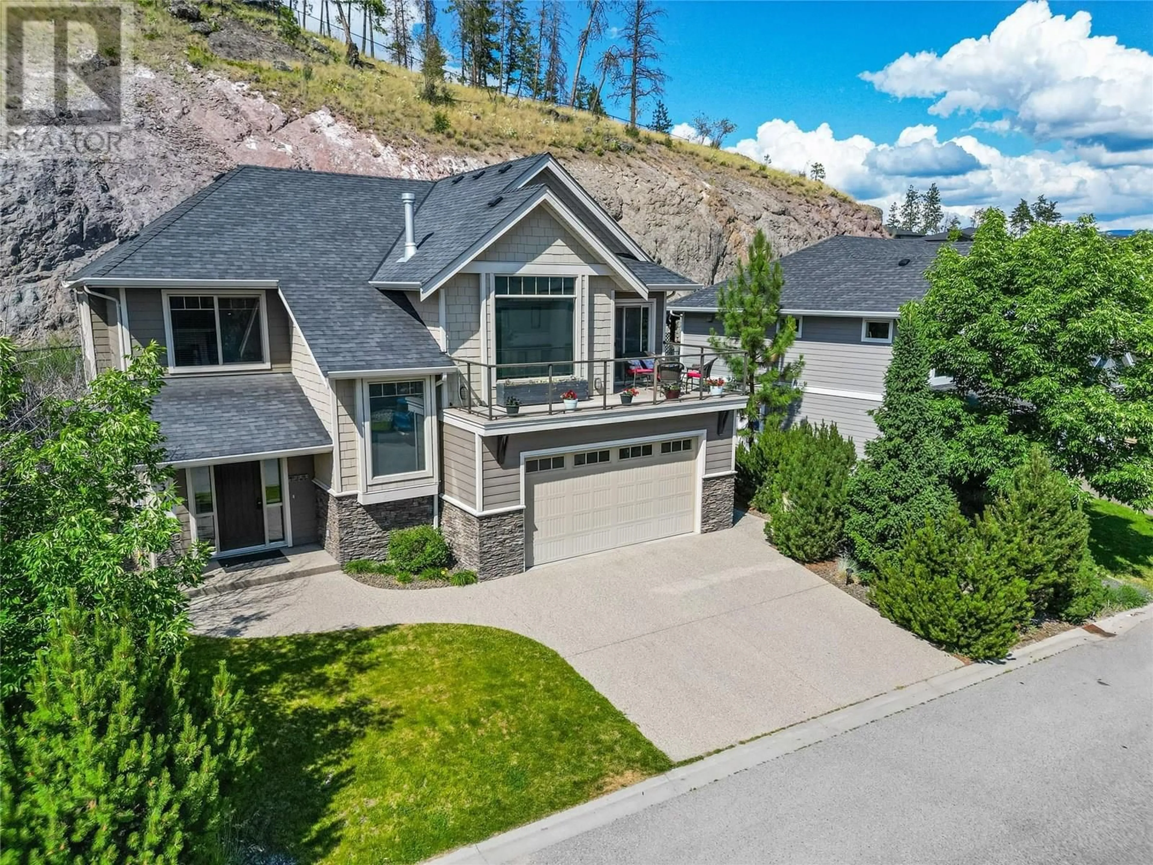 A pic from outside/outdoor area/front of a property/back of a property/a pic from drone, mountain view for 1338 ROCKY POINT DRIVE, Kelowna British Columbia V1V2Z9