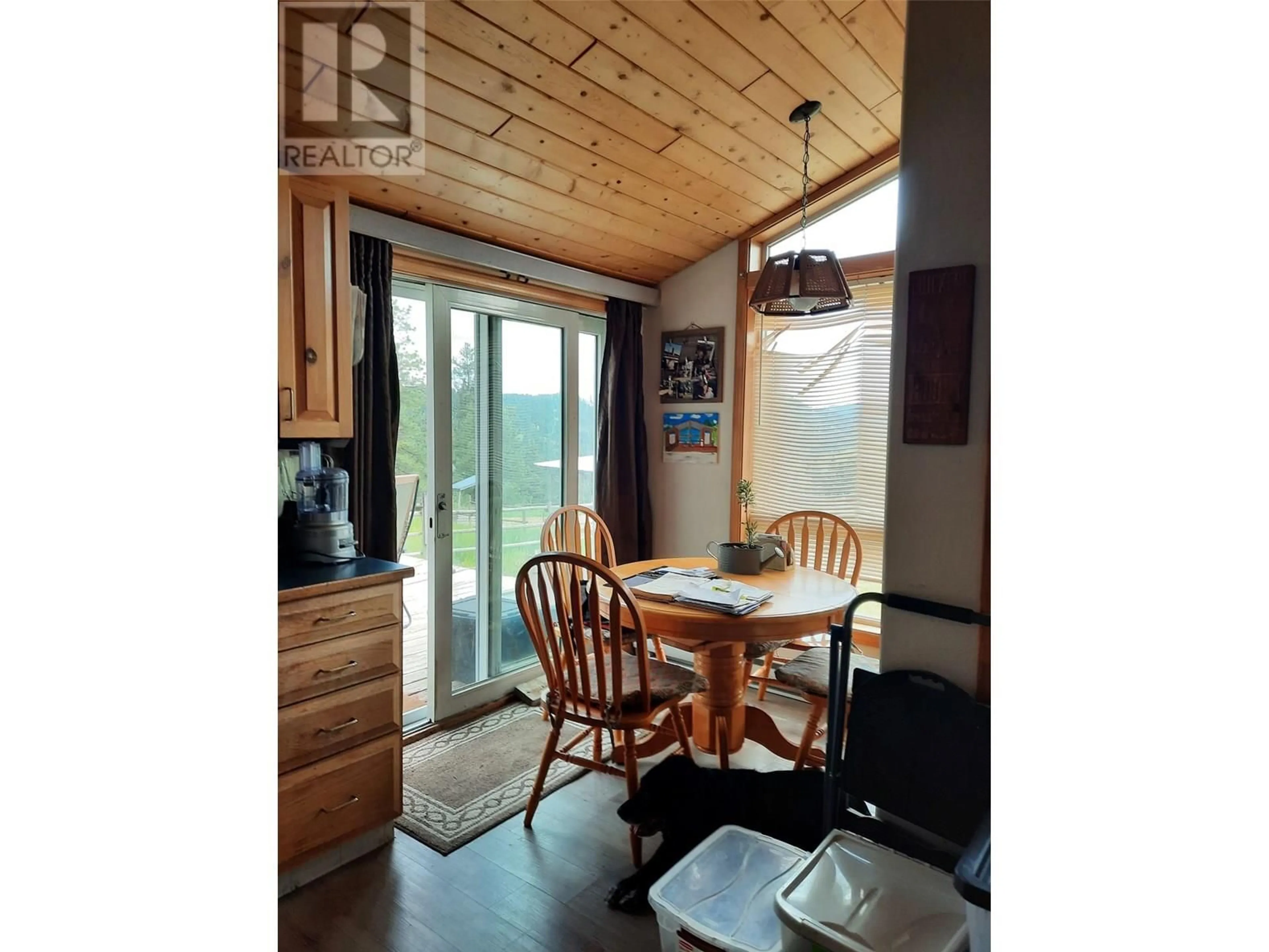 Dining room, wood/laminate floor for 3055 INGRAM CREEK ROAD, Midway British Columbia V0H1M0