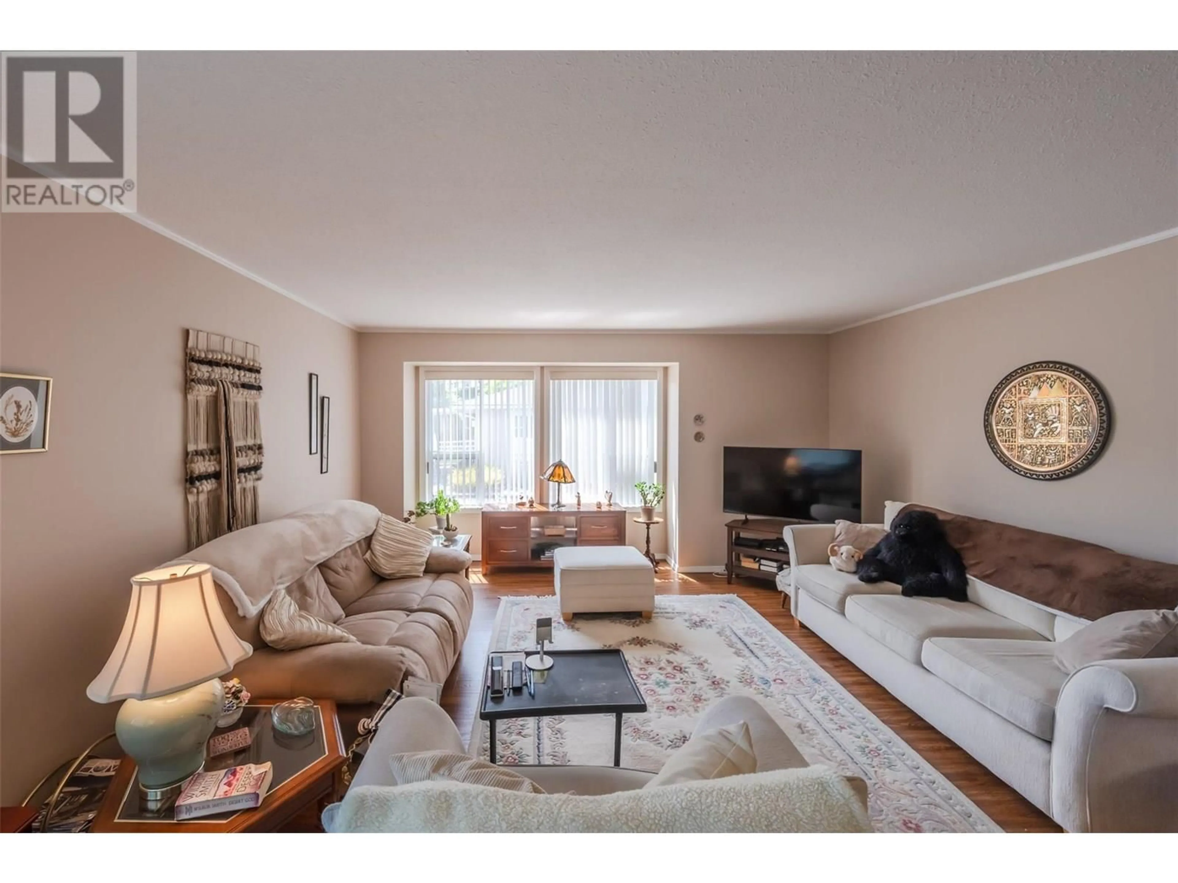 Living room with furniture, wood/laminate floor for 4 - 12606 TEMPLE COURT, Summerland British Columbia V0H1Z4