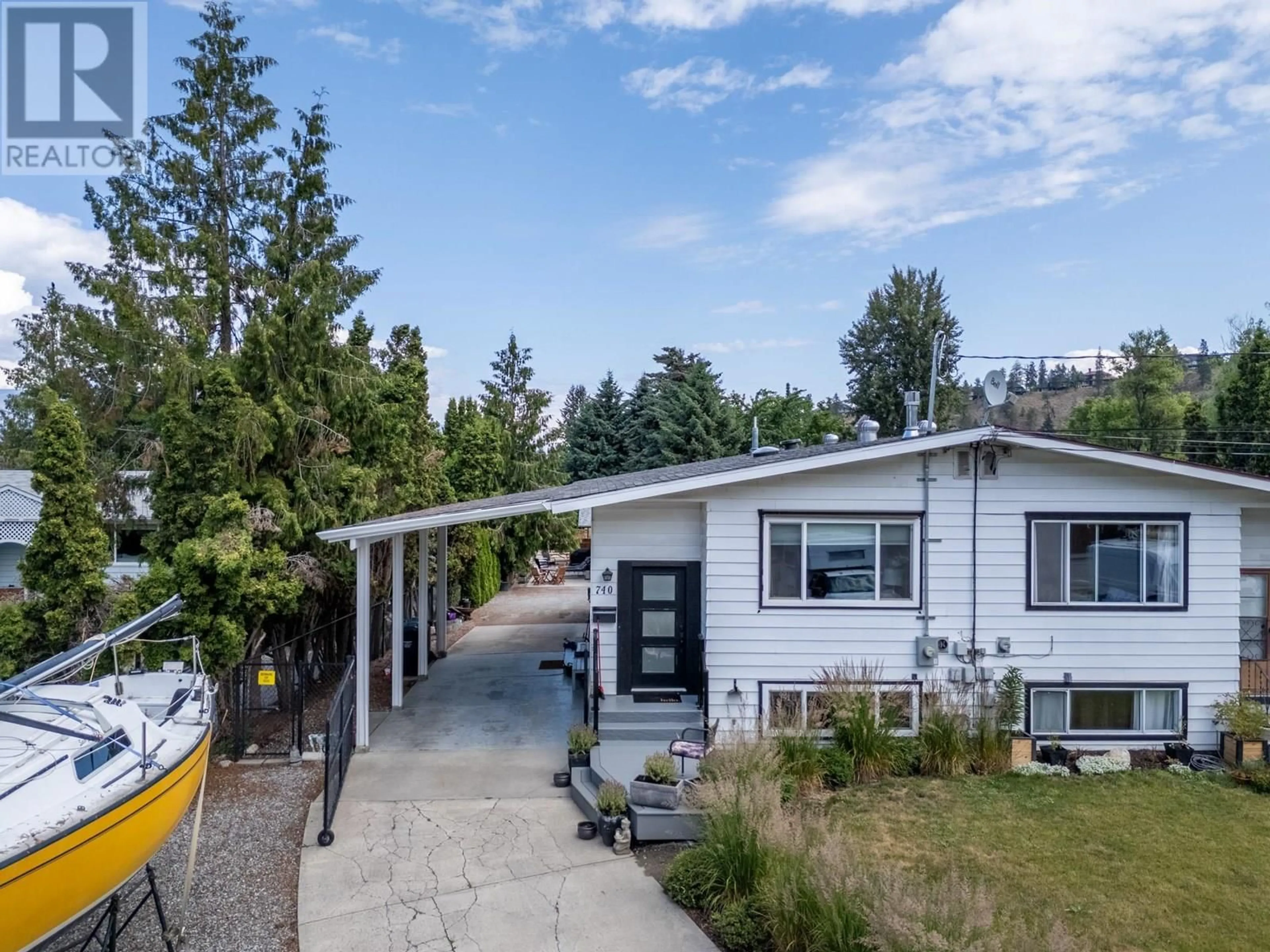 A pic from outside/outdoor area/front of a property/back of a property/a pic from drone, street for 740 MCCLURE ROAD, Kelowna British Columbia V1W1M3