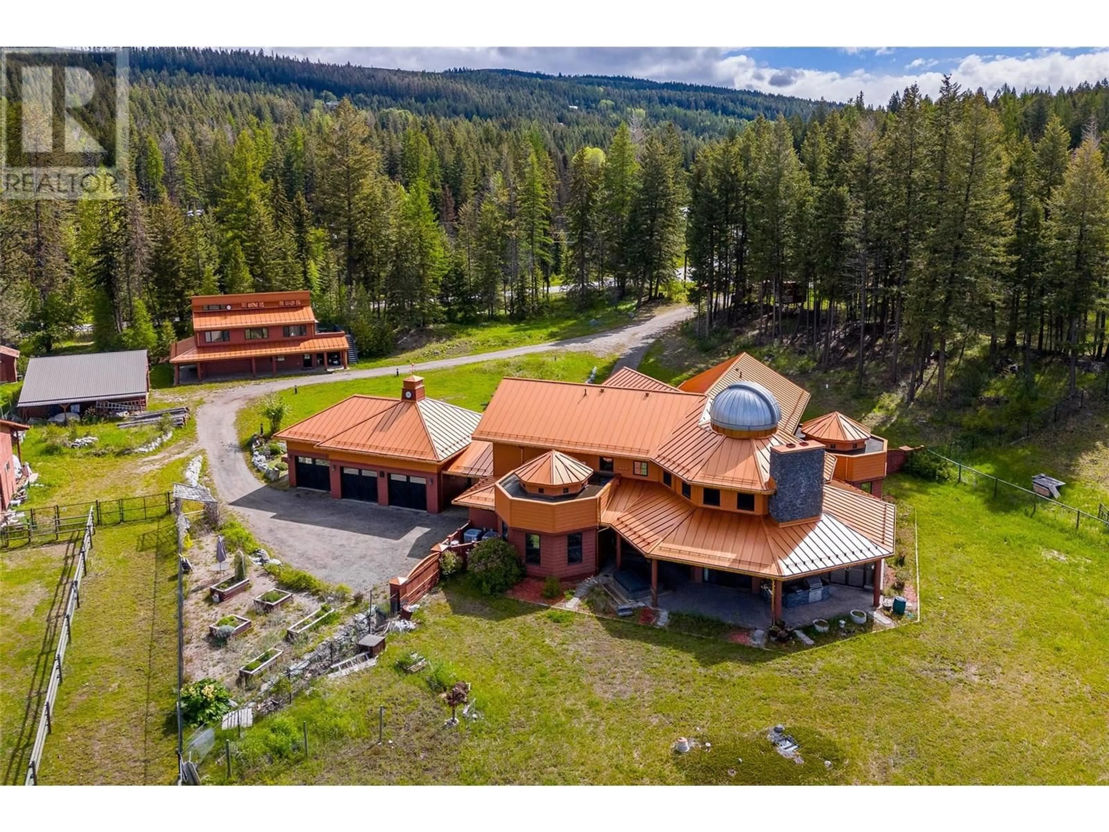 A pic from outside/outdoor area/front of a property/back of a property/a pic from drone, mountain view for 1306 HUCKLEBERRY ROAD, Kelowna British Columbia V1P1M5