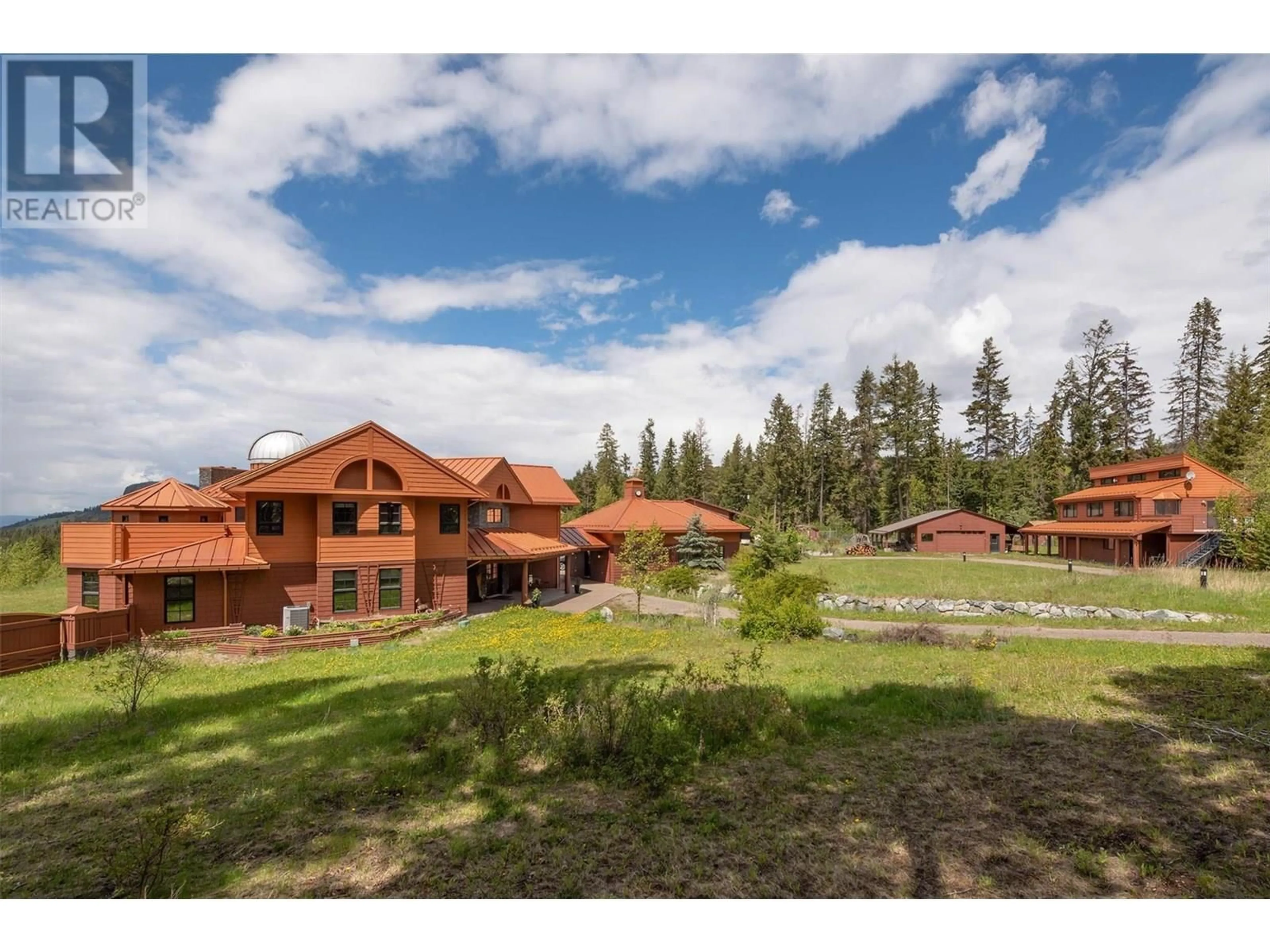 A pic from outside/outdoor area/front of a property/back of a property/a pic from drone, mountain view for 1306 HUCKLEBERRY ROAD, Kelowna British Columbia V1P1M5