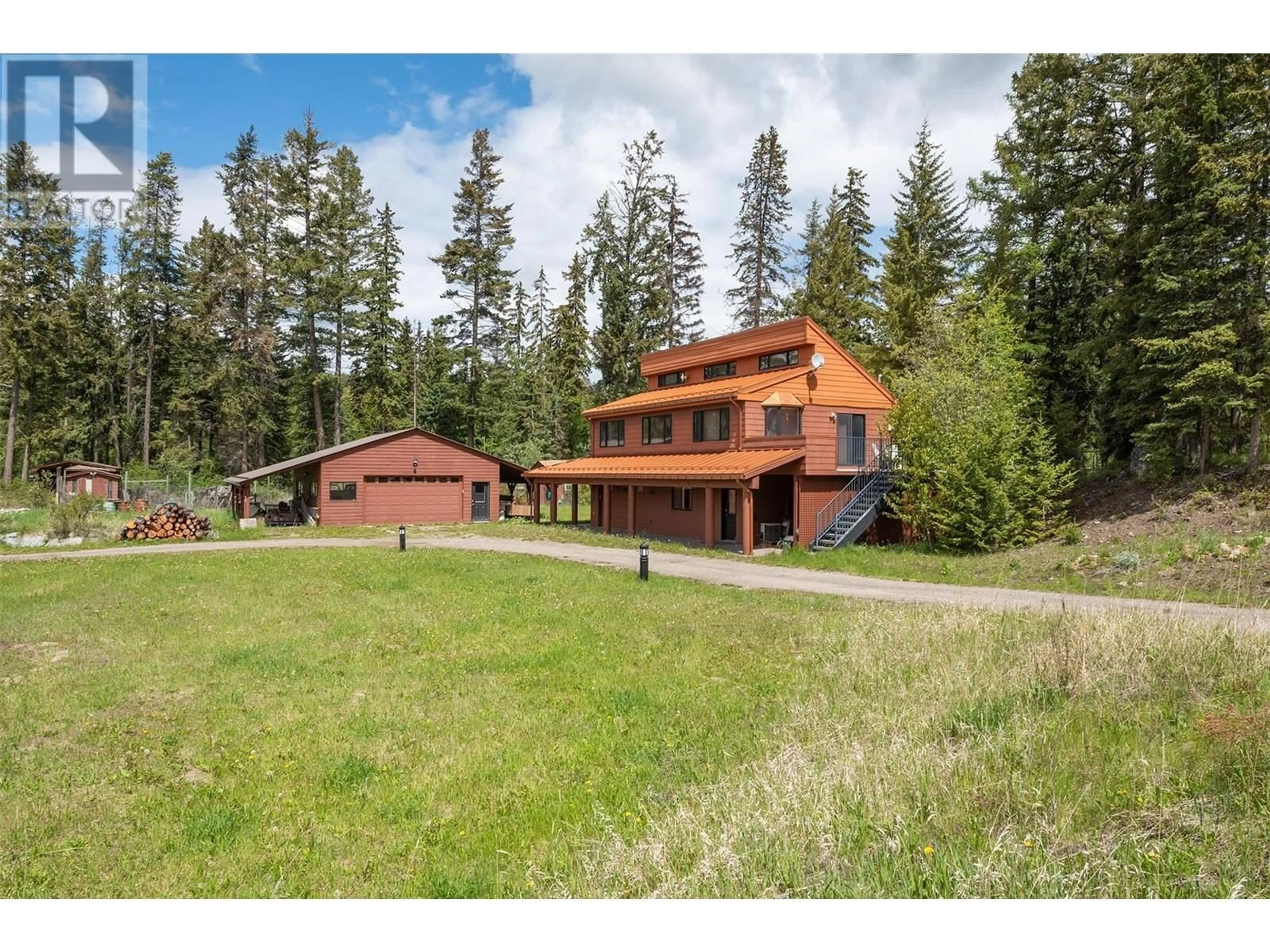A pic from outside/outdoor area/front of a property/back of a property/a pic from drone, mountain view for 1306 HUCKLEBERRY ROAD, Kelowna British Columbia V1P1M5