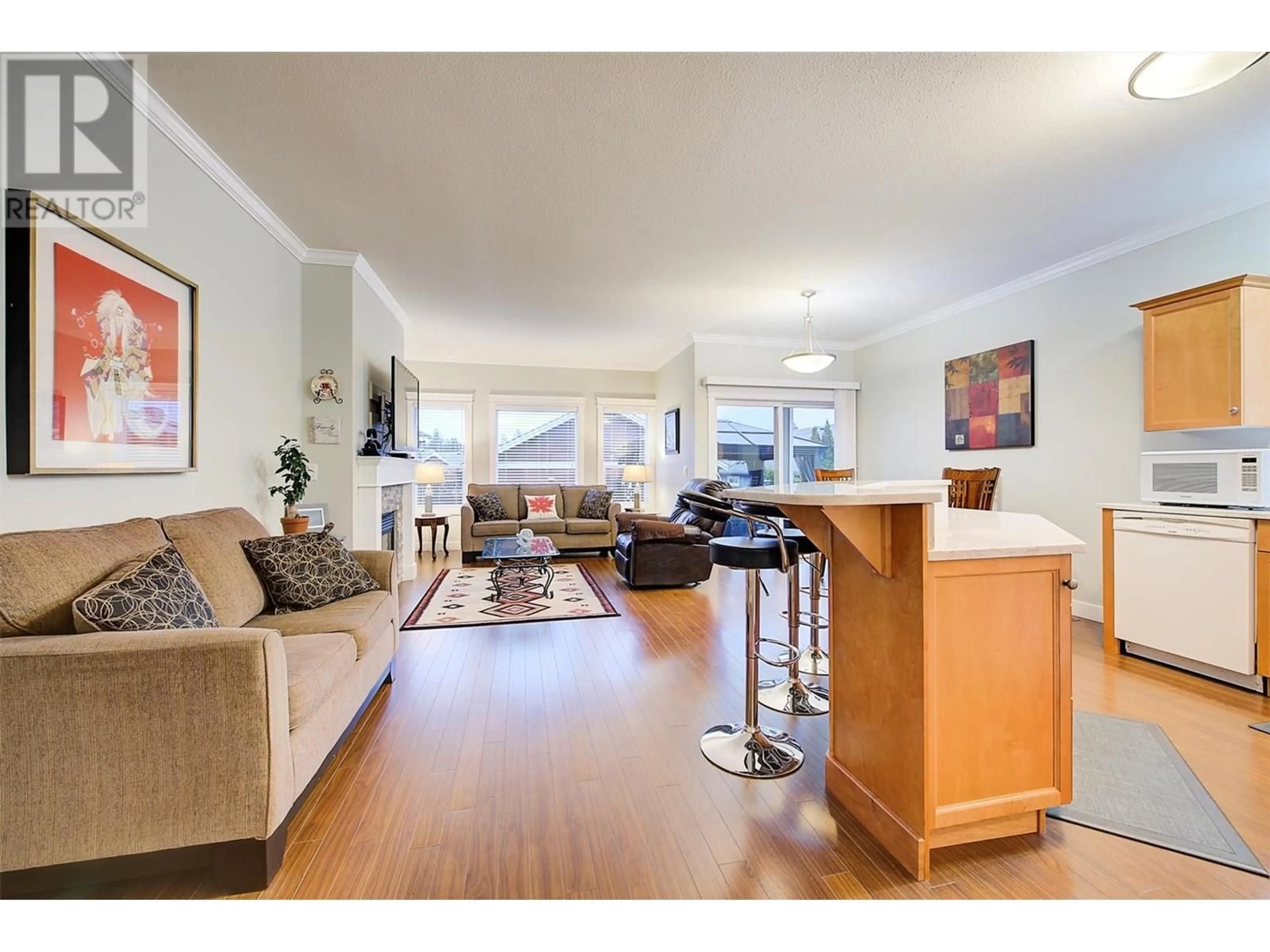 Living room with furniture, wood/laminate floor for 2171 MIMOSA DRIVE, West Kelowna British Columbia V4T3A5