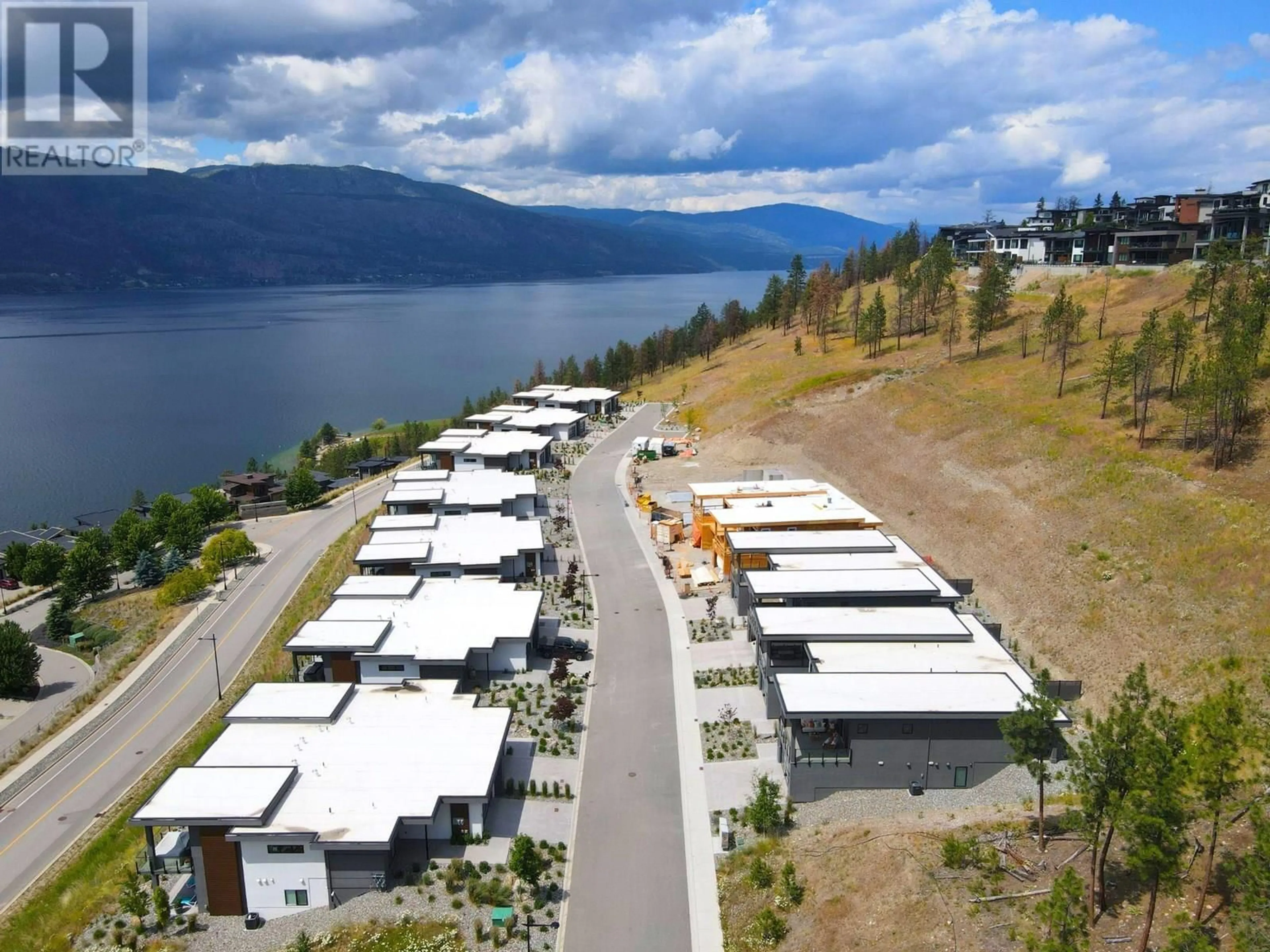 A pic from outside/outdoor area/front of a property/back of a property/a pic from drone, water/lake/river/ocean view for 22 - 9201 OKANAGAN CENTRE ROAD WEST, Lake Country British Columbia V4V0B8