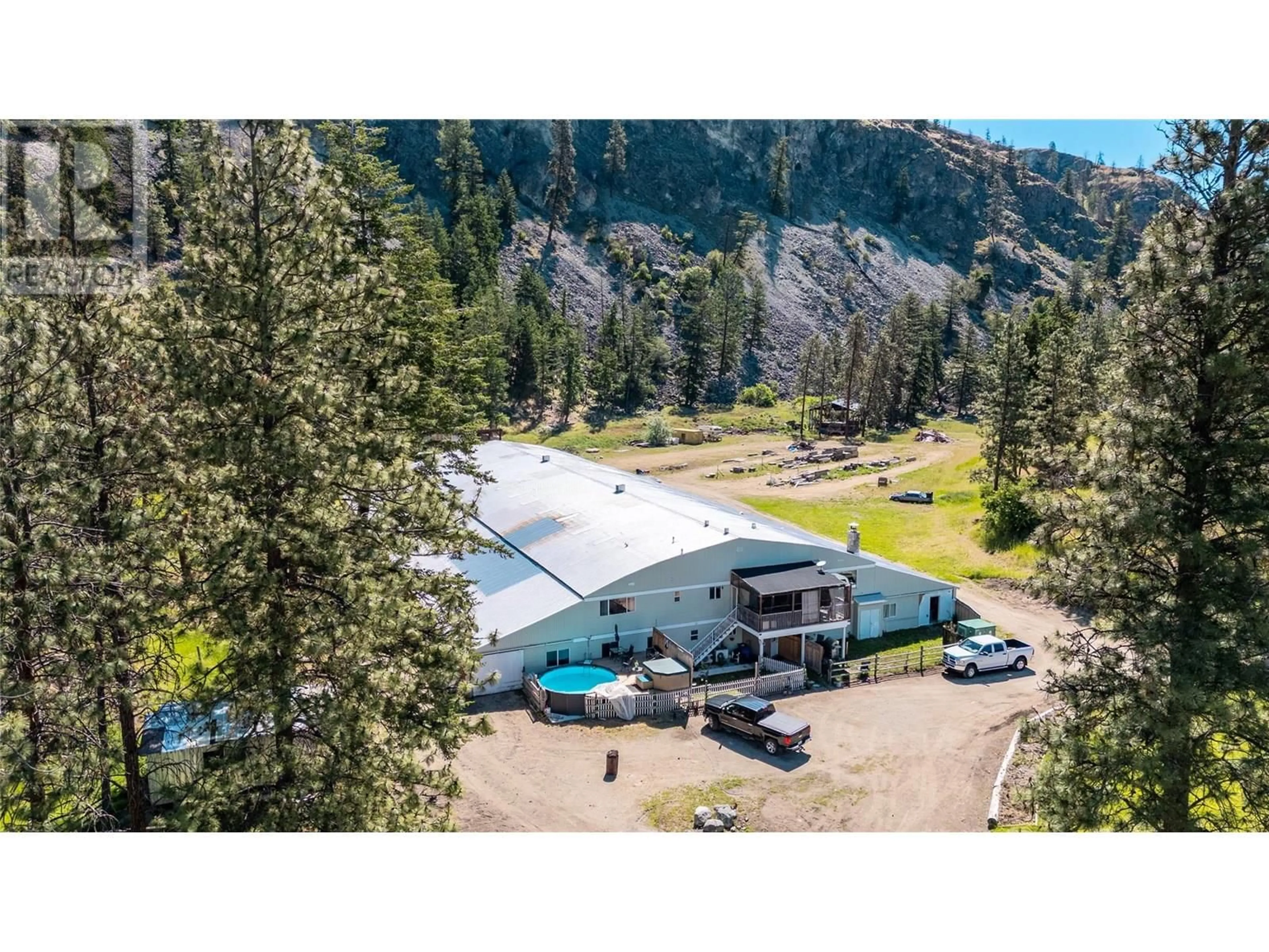 A pic from outside/outdoor area/front of a property/back of a property/a pic from drone, mountain view for 3803 MCLEAN CREEK ROAD, Okanagan Falls British Columbia V0H1R1