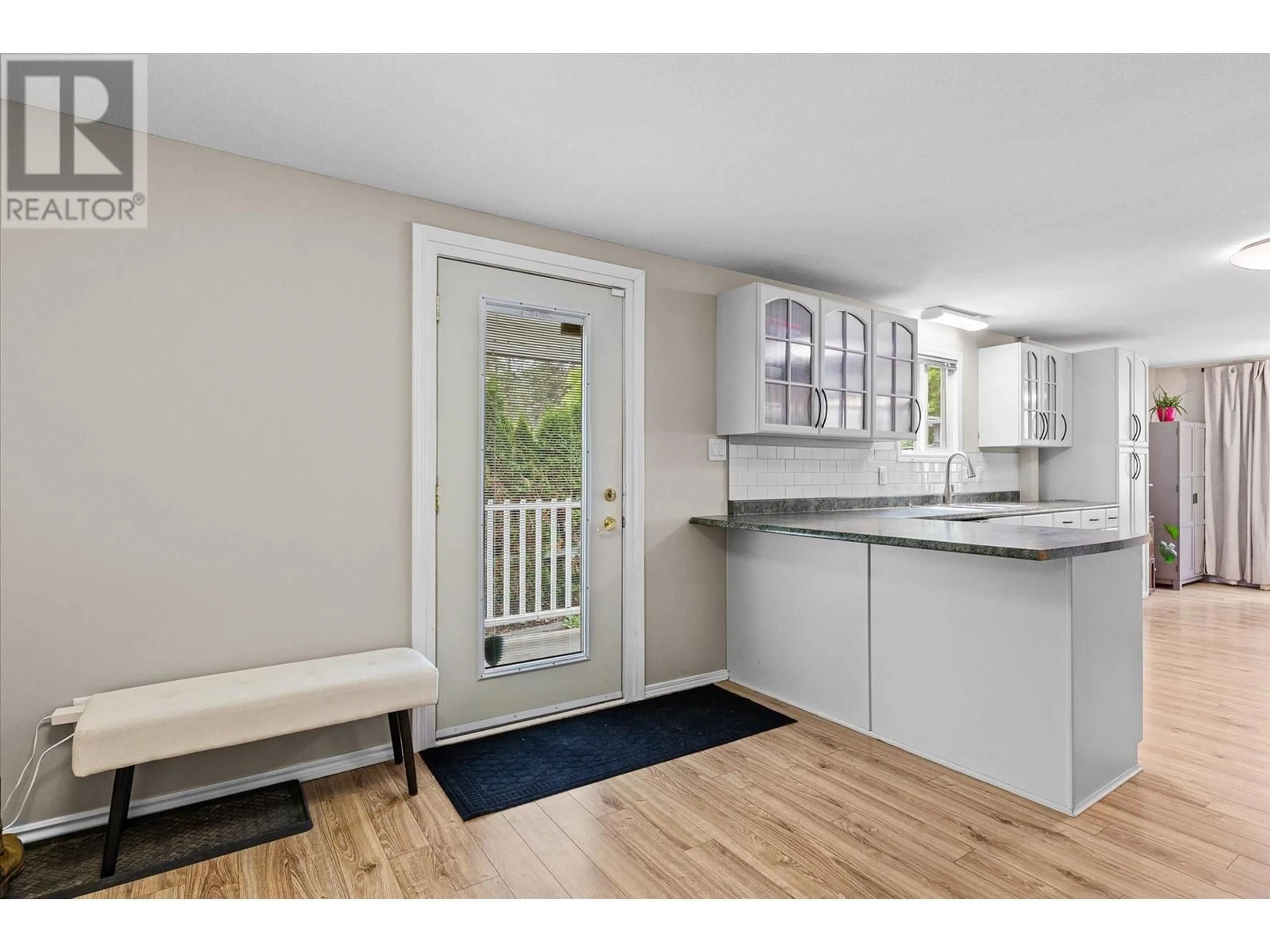 Open concept kitchen, wood/laminate floor for 116 - 1999 97 HIGHWAY SOUTH, West Kelowna British Columbia V1Z1B2