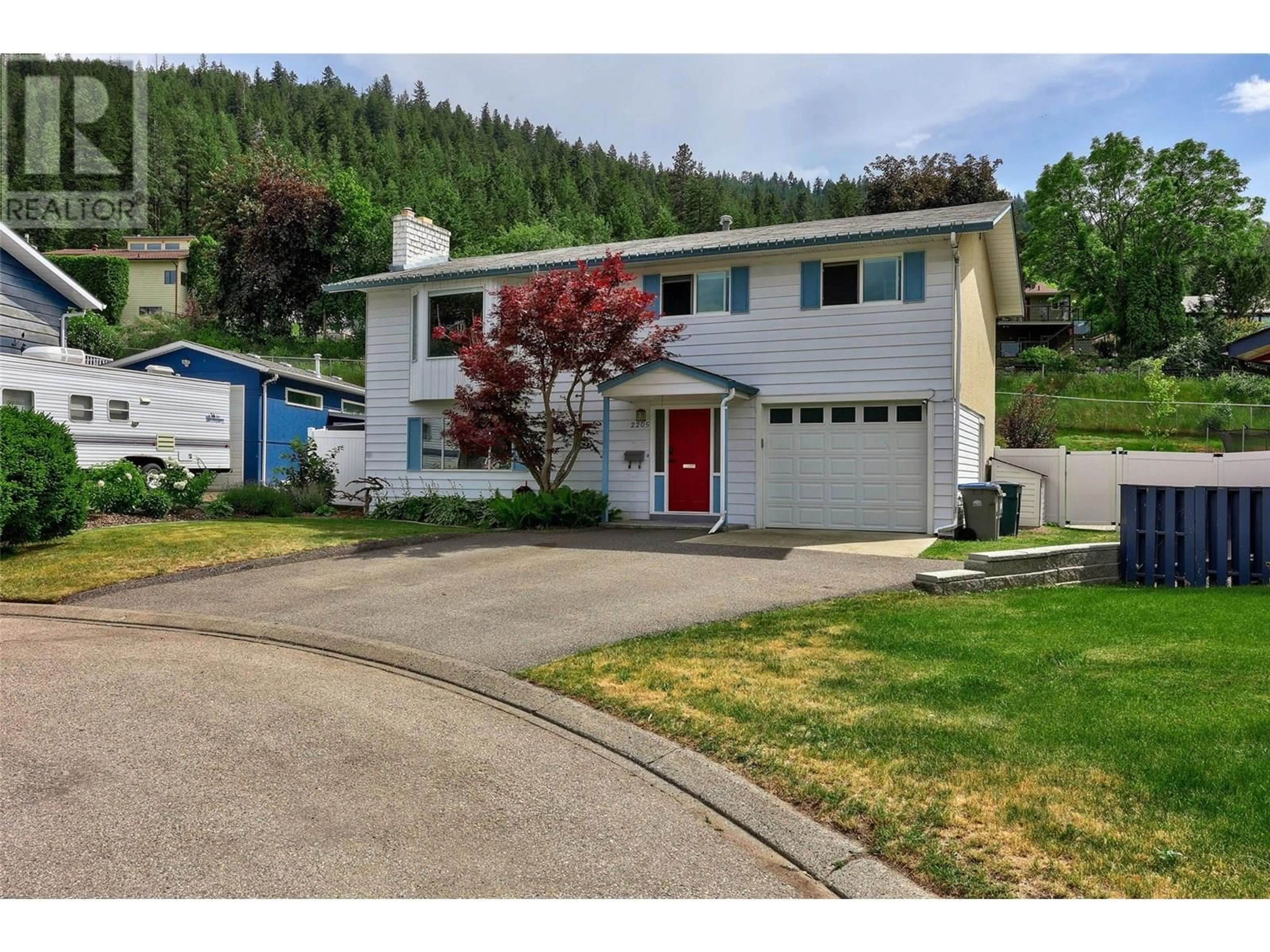 Home with vinyl exterior material, street for 2205 OMINECA DRIVE, Kamloops British Columbia V2E1S8