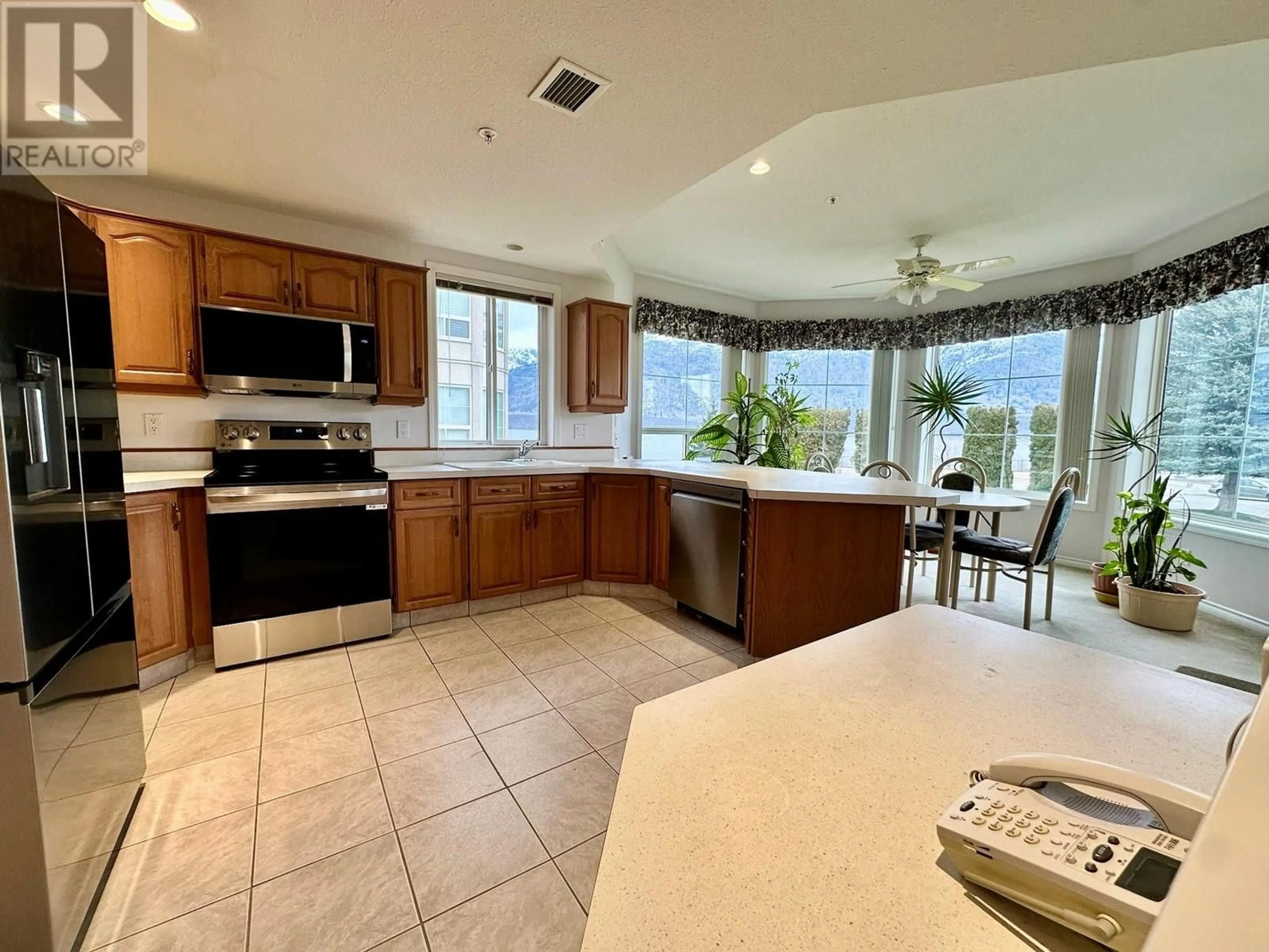 Open concept kitchen, ceramic/tile floor for 215 - 7801 SPARTAN DRIVE, Osoyoos British Columbia V0H1V0