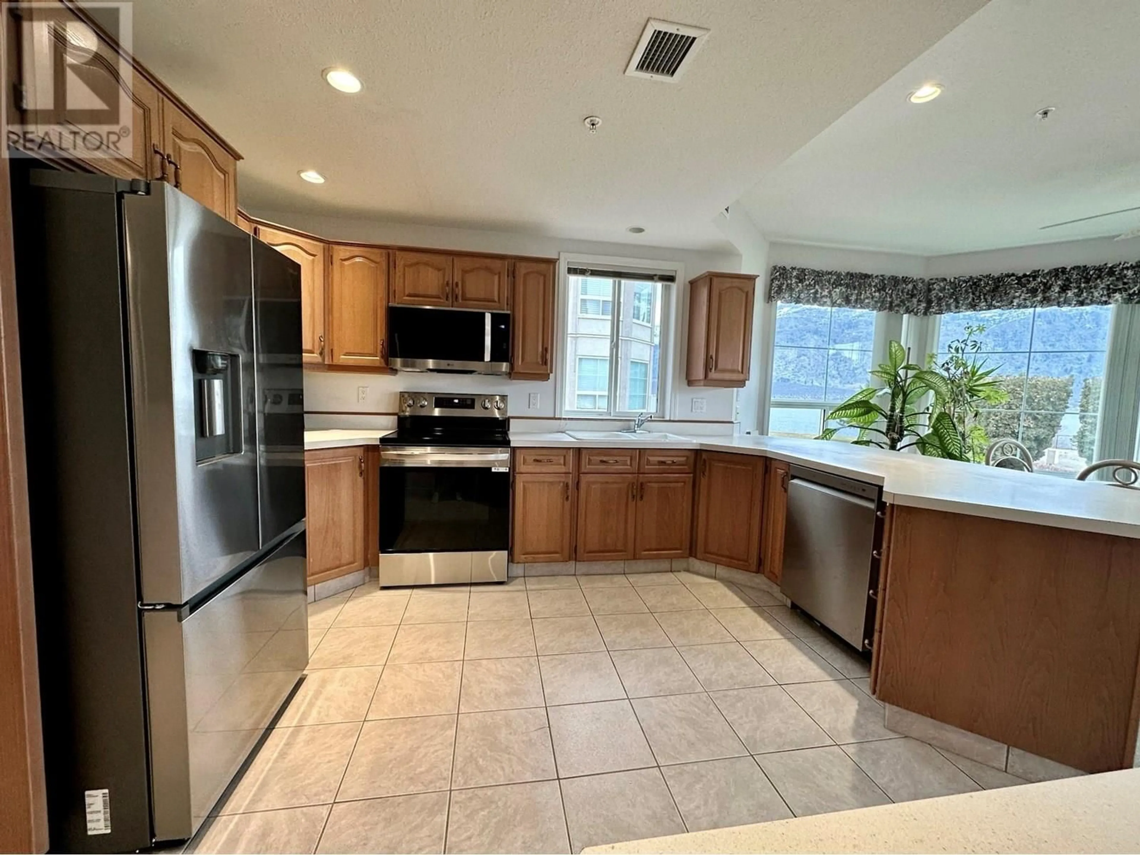 Open concept kitchen, ceramic/tile floor for 215 - 7801 SPARTAN DRIVE, Osoyoos British Columbia V0H1V0