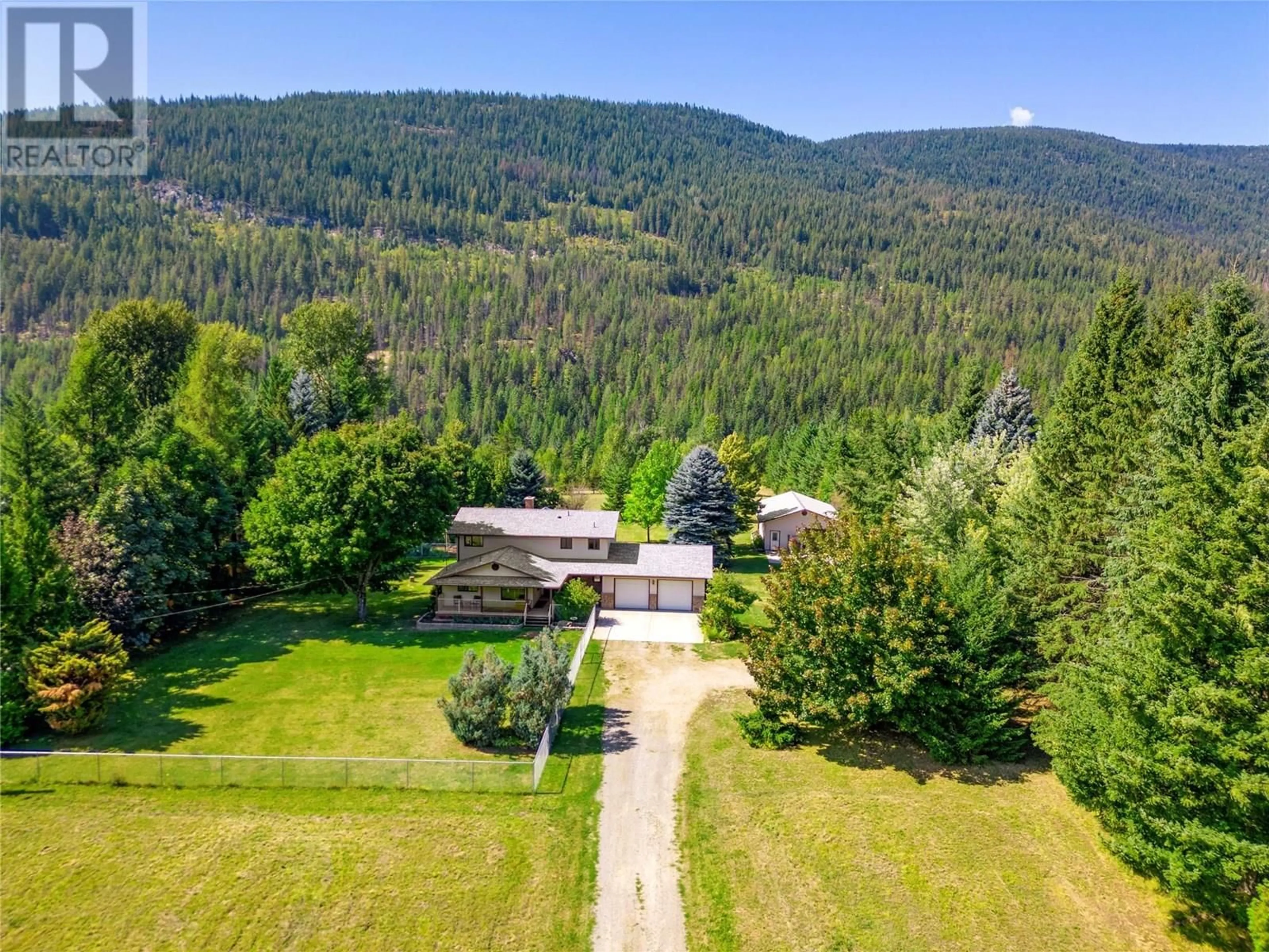 A pic from outside/outdoor area/front of a property/back of a property/a pic from drone, mountain view for 1802 PASS CREEK ROAD, Castlegar British Columbia V1N4S6