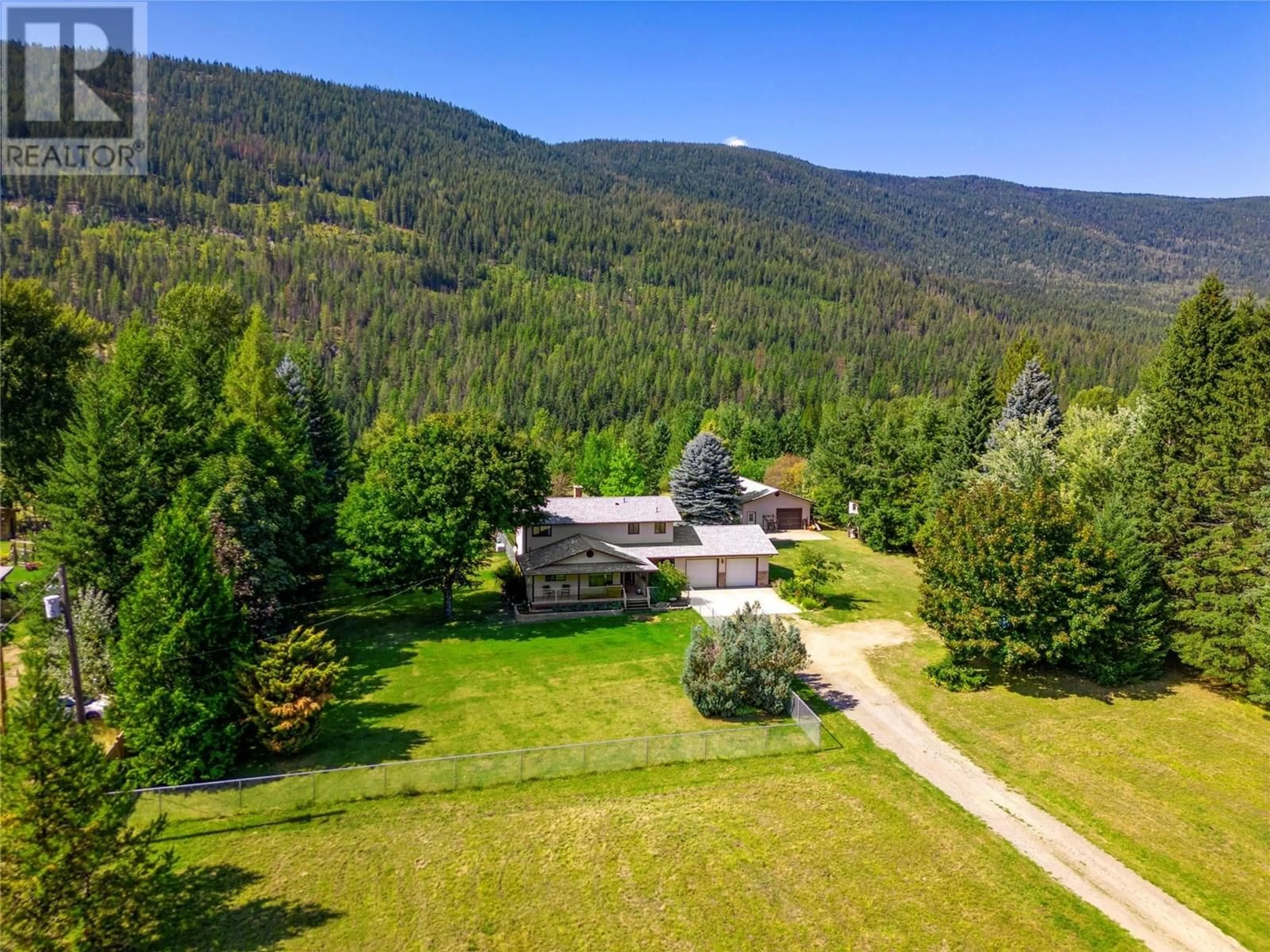 A pic from outside/outdoor area/front of a property/back of a property/a pic from drone, mountain view for 1802 PASS CREEK ROAD, Castlegar British Columbia V1N4S6