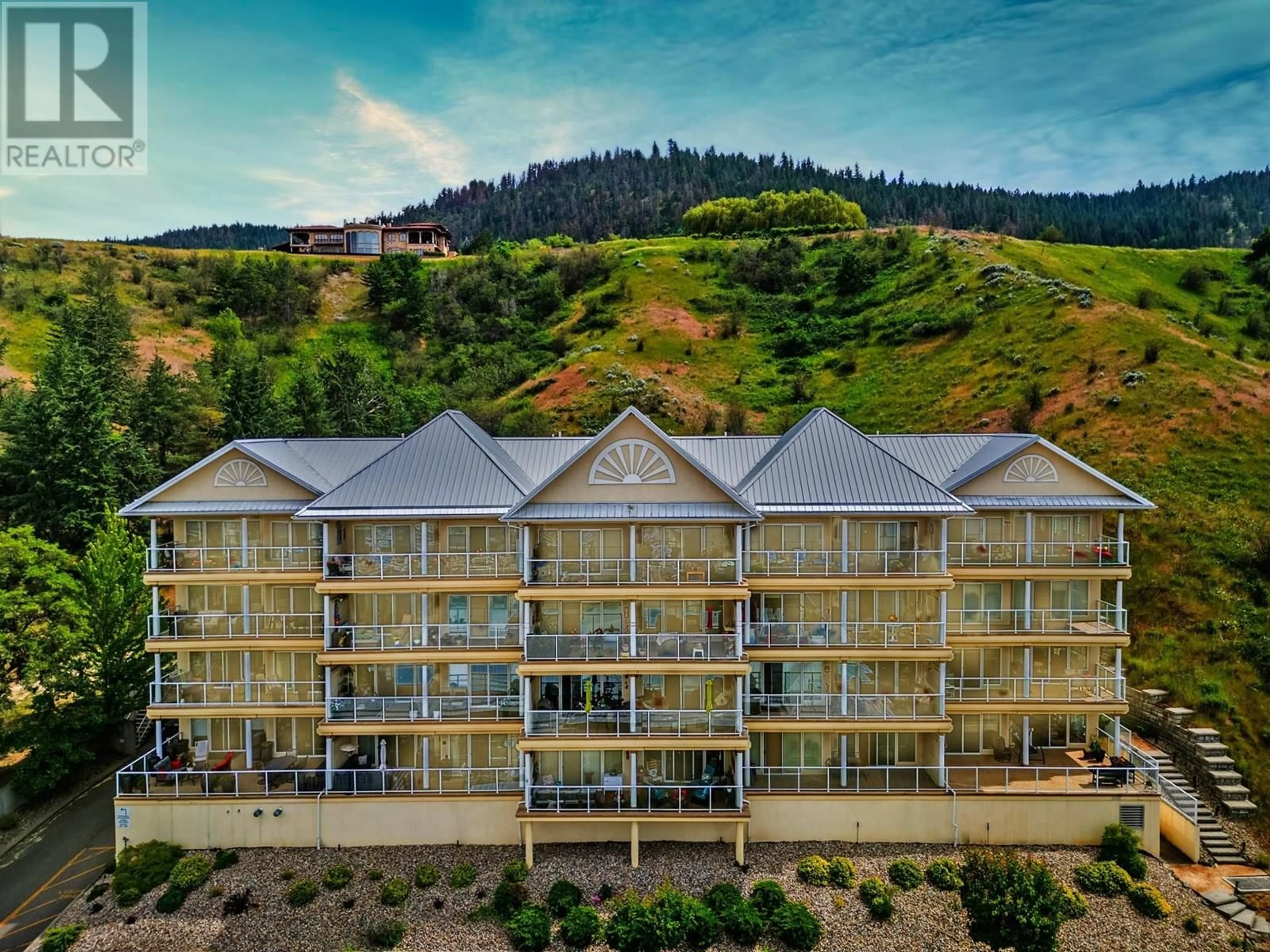 A pic from outside/outdoor area/front of a property/back of a property/a pic from drone, building for 401 - 7922 OKANAGAN LANDING ROAD, Vernon British Columbia V1H2K5
