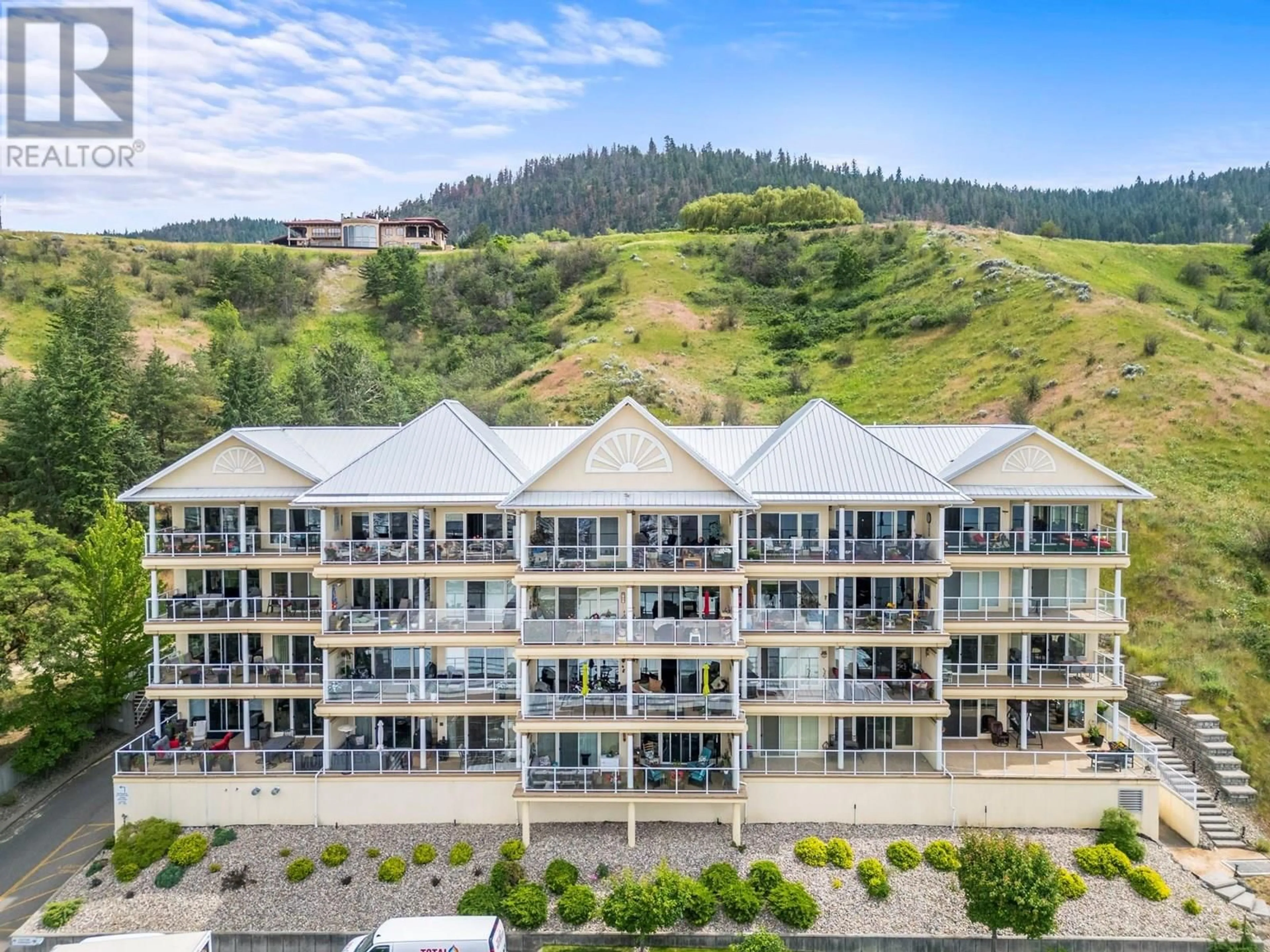 A pic from outside/outdoor area/front of a property/back of a property/a pic from drone, unknown for 401 - 7922 OKANAGAN LANDING ROAD, Vernon British Columbia V1H2K5