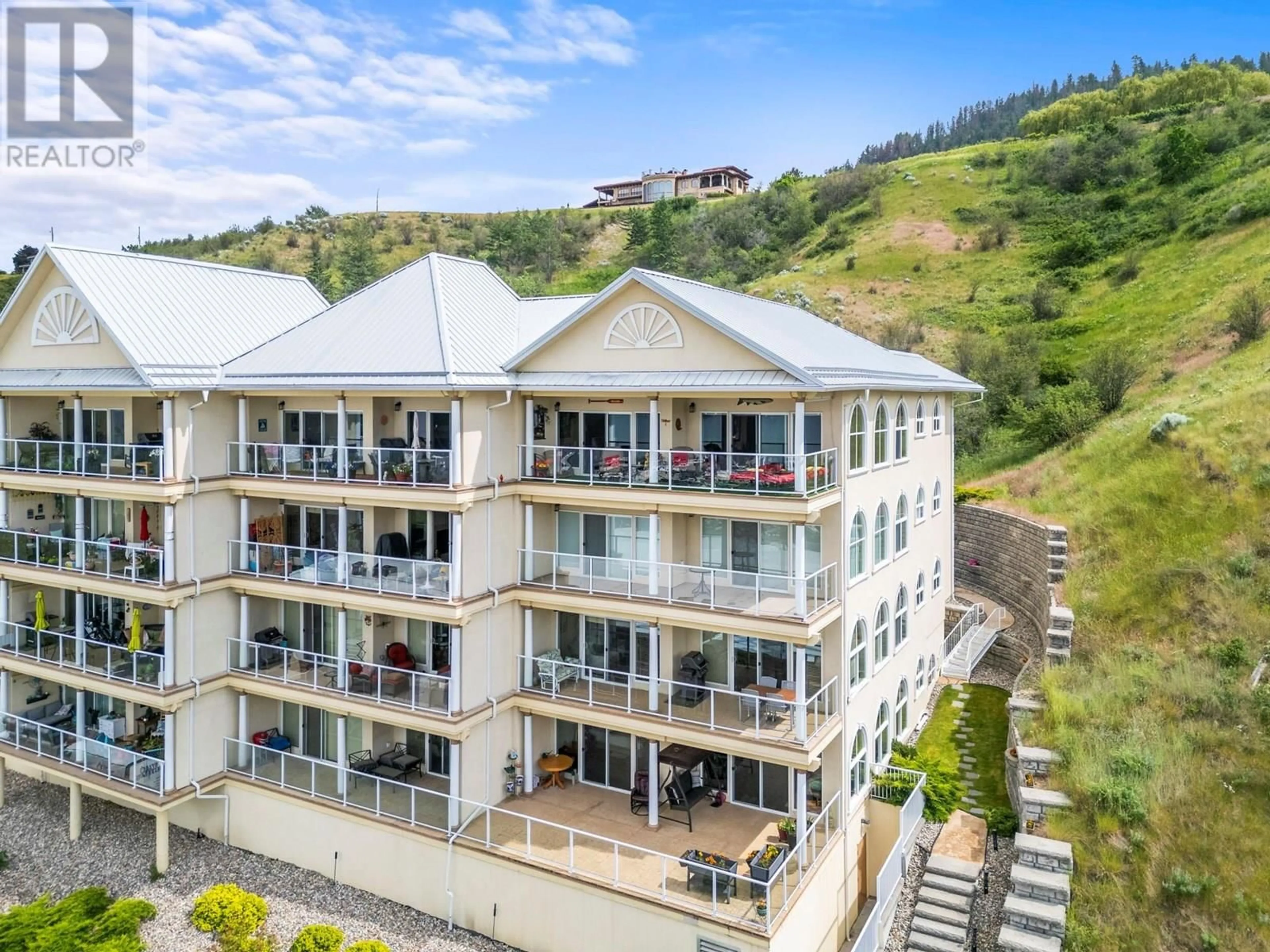 A pic from outside/outdoor area/front of a property/back of a property/a pic from drone, building for 401 - 7922 OKANAGAN LANDING ROAD, Vernon British Columbia V1H2K5