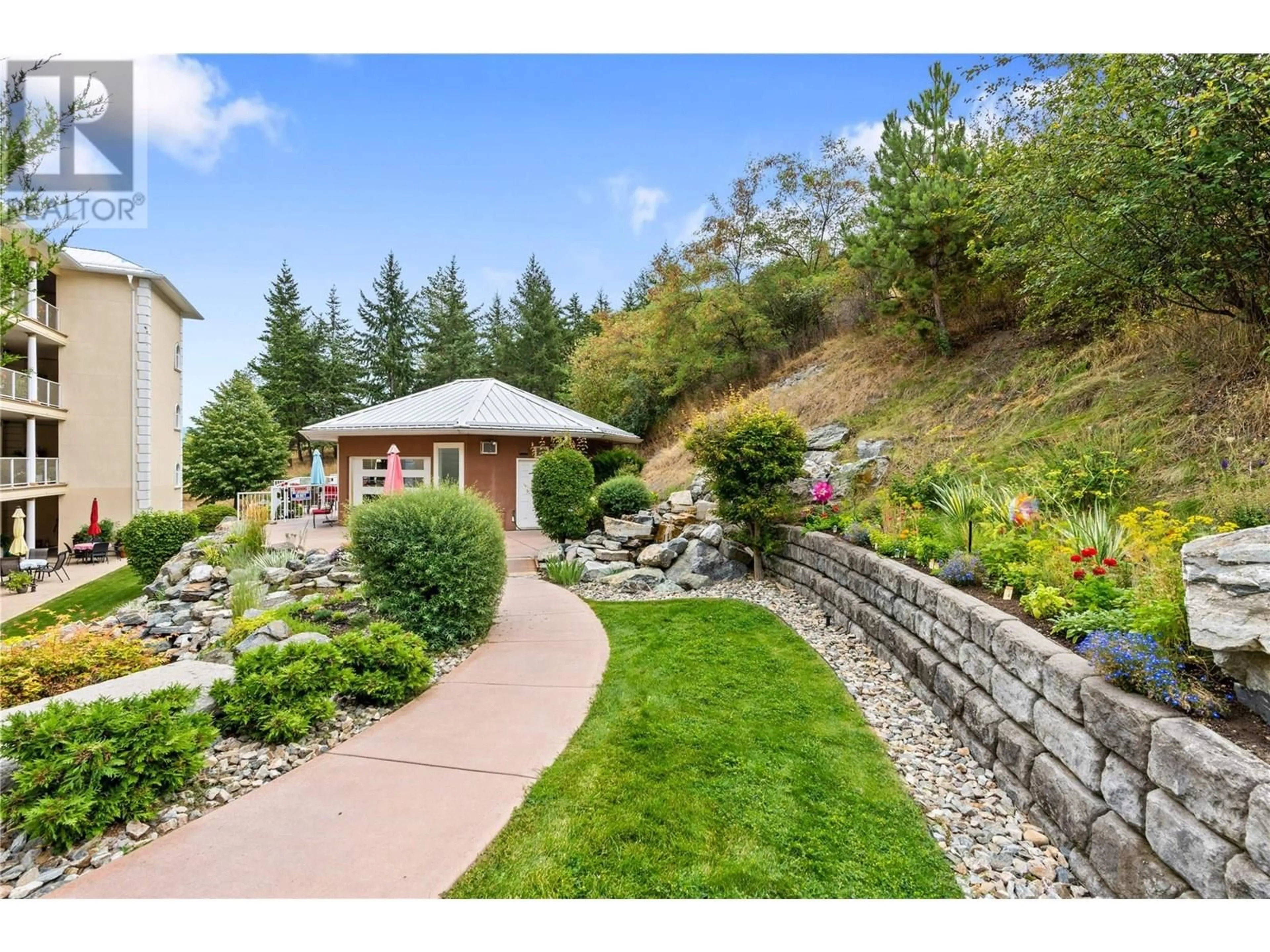 A pic from outside/outdoor area/front of a property/back of a property/a pic from drone, mountain view for 401 - 7922 OKANAGAN LANDING ROAD, Vernon British Columbia V1H2K5