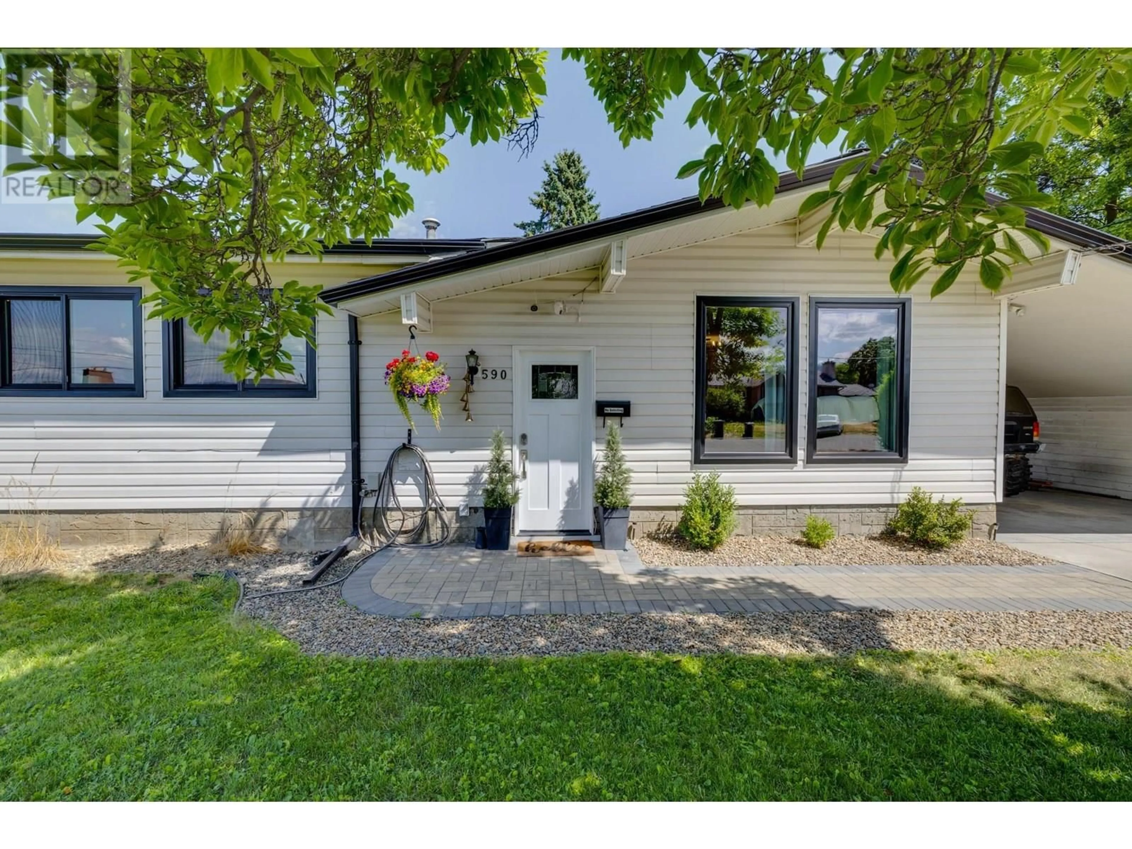 Home with vinyl exterior material, street for 590 JASCHINSKY ROAD, Kelowna British Columbia V1X1L8