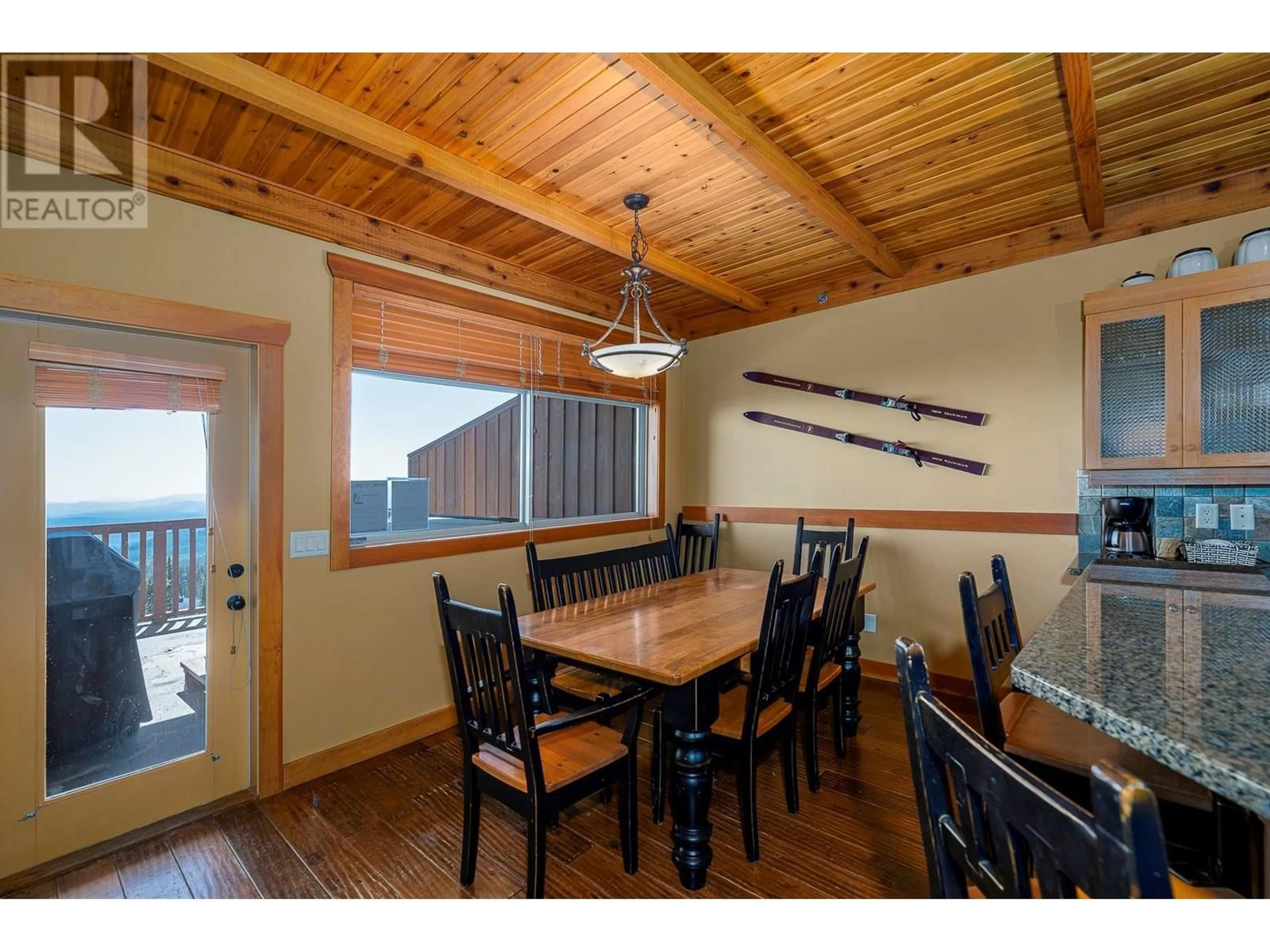 Dining room, wood/laminate floor for 112 - 250 FEATHERTOP WAY, Big White British Columbia V1P1T4