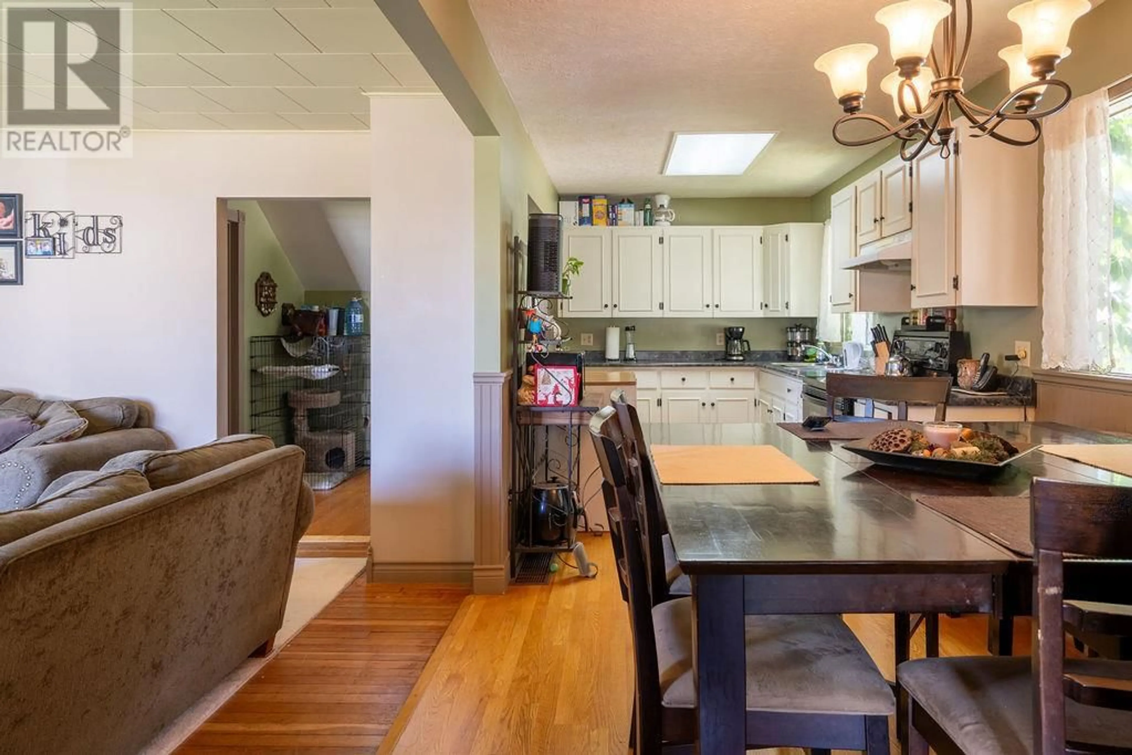 Open concept kitchen, wood/laminate floor for 616 VERNON AVENUE EAST, Revelstoke British Columbia V0E2S0