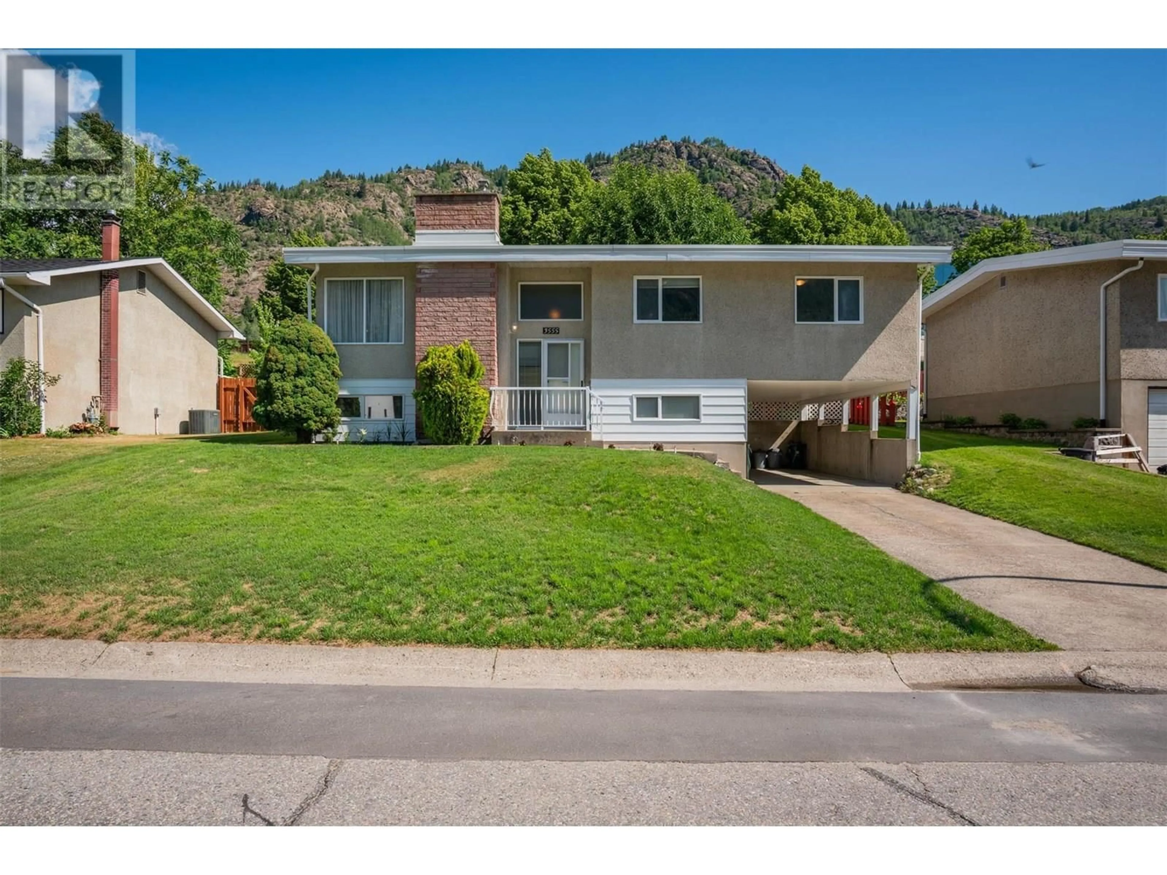 Home with vinyl exterior material, street for 3555 HIGHWAY DRIVE, Trail British Columbia V1R2T9