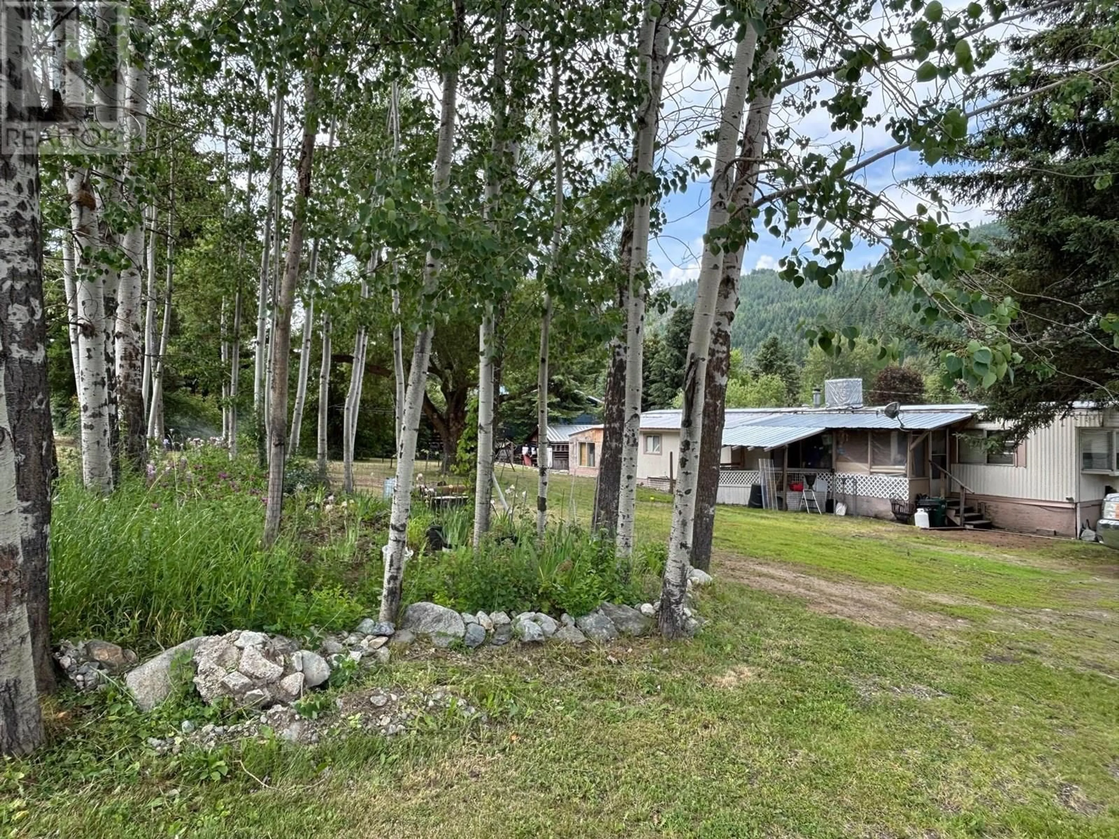 A pic from outside/outdoor area/front of a property/back of a property/a pic from drone, forest/trees view for 360 3RD STREET, Greenwood British Columbia V0H1J0