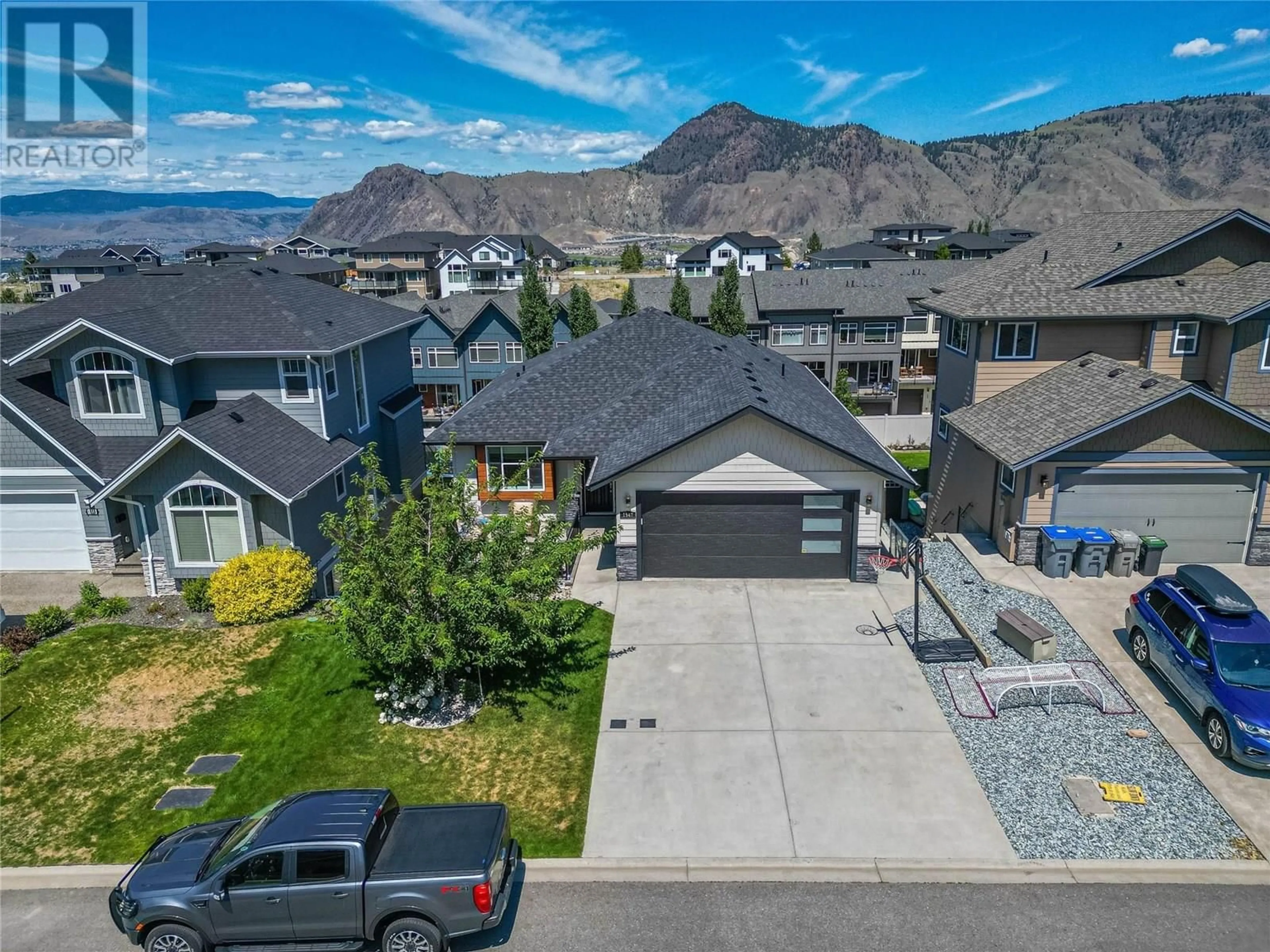 A pic from outside/outdoor area/front of a property/back of a property/a pic from drone, mountain view for 1547 EMERALD DRIVE, Kamloops British Columbia V2E0C4
