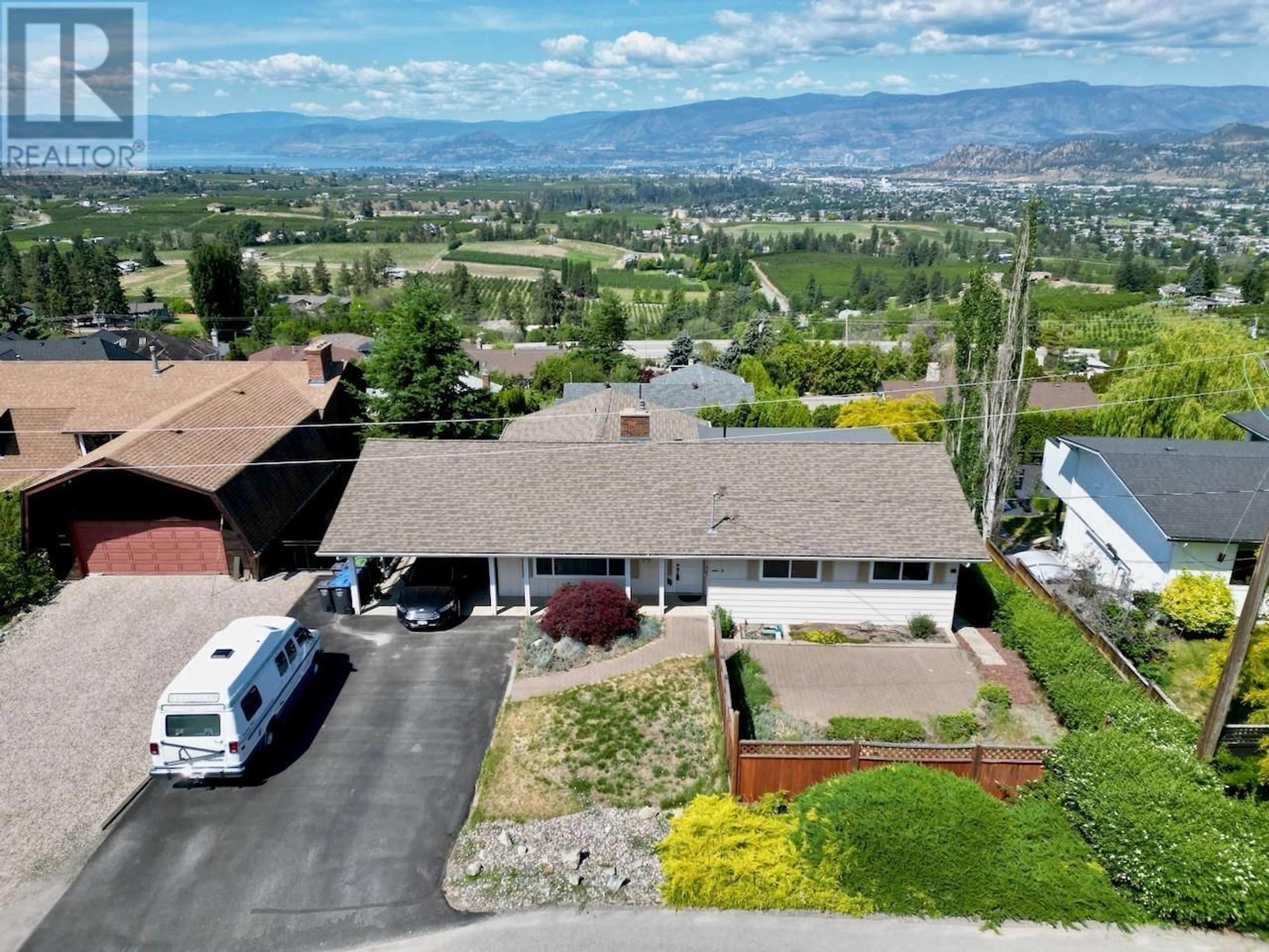 A pic from outside/outdoor area/front of a property/back of a property/a pic from drone, mountain view for 1270 TOOVEY ROAD, Kelowna British Columbia V1X6R4
