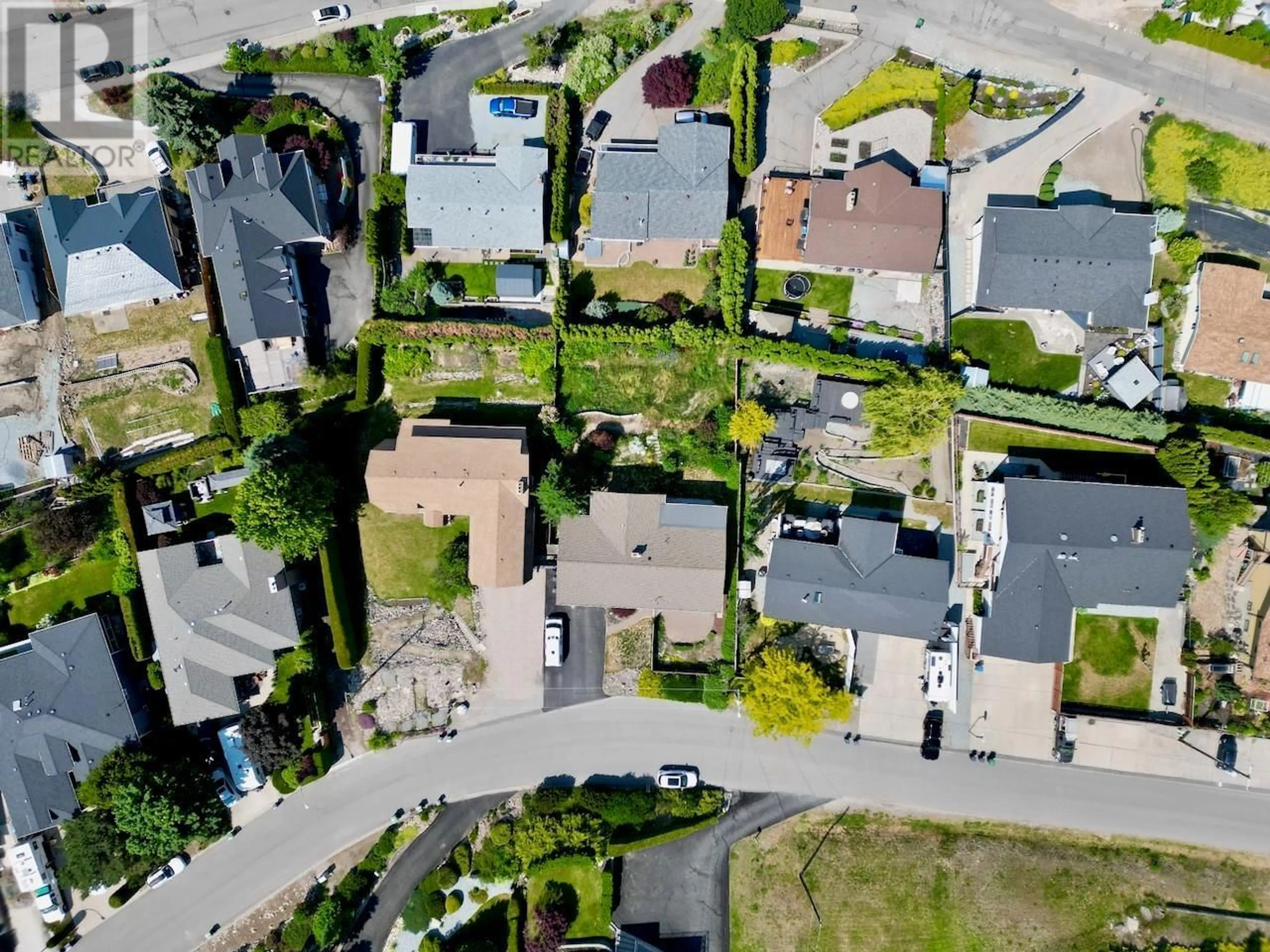 A pic from outside/outdoor area/front of a property/back of a property/a pic from drone, street for 1270 TOOVEY ROAD, Kelowna British Columbia V1X6R4